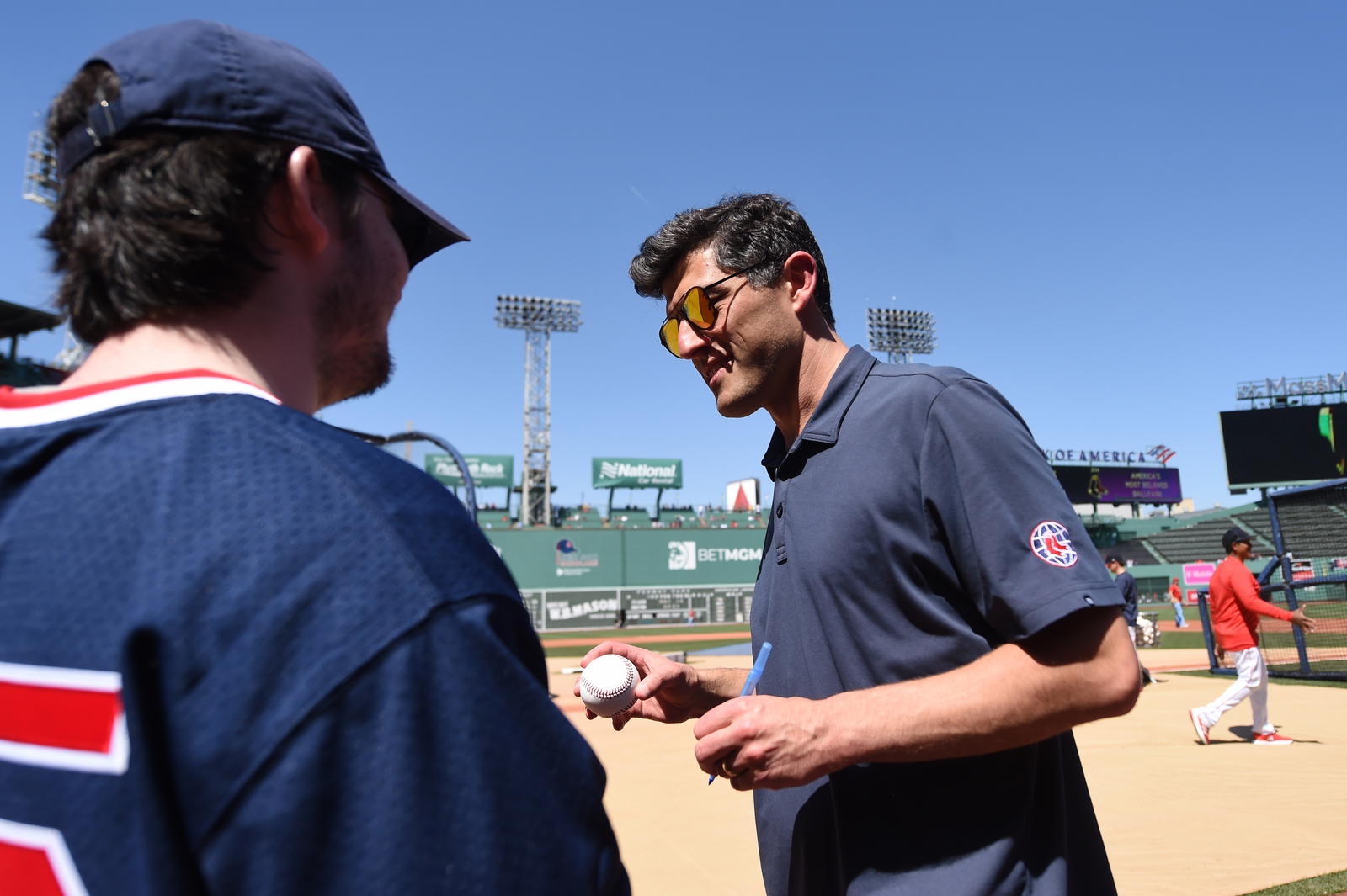 Boston Red Sox chief baseball officer Chaim Bloom signs an autograph prior to a game against the against the St. Louis Cardinals at Fenway Park. Bob DeChiara-Imagn Images