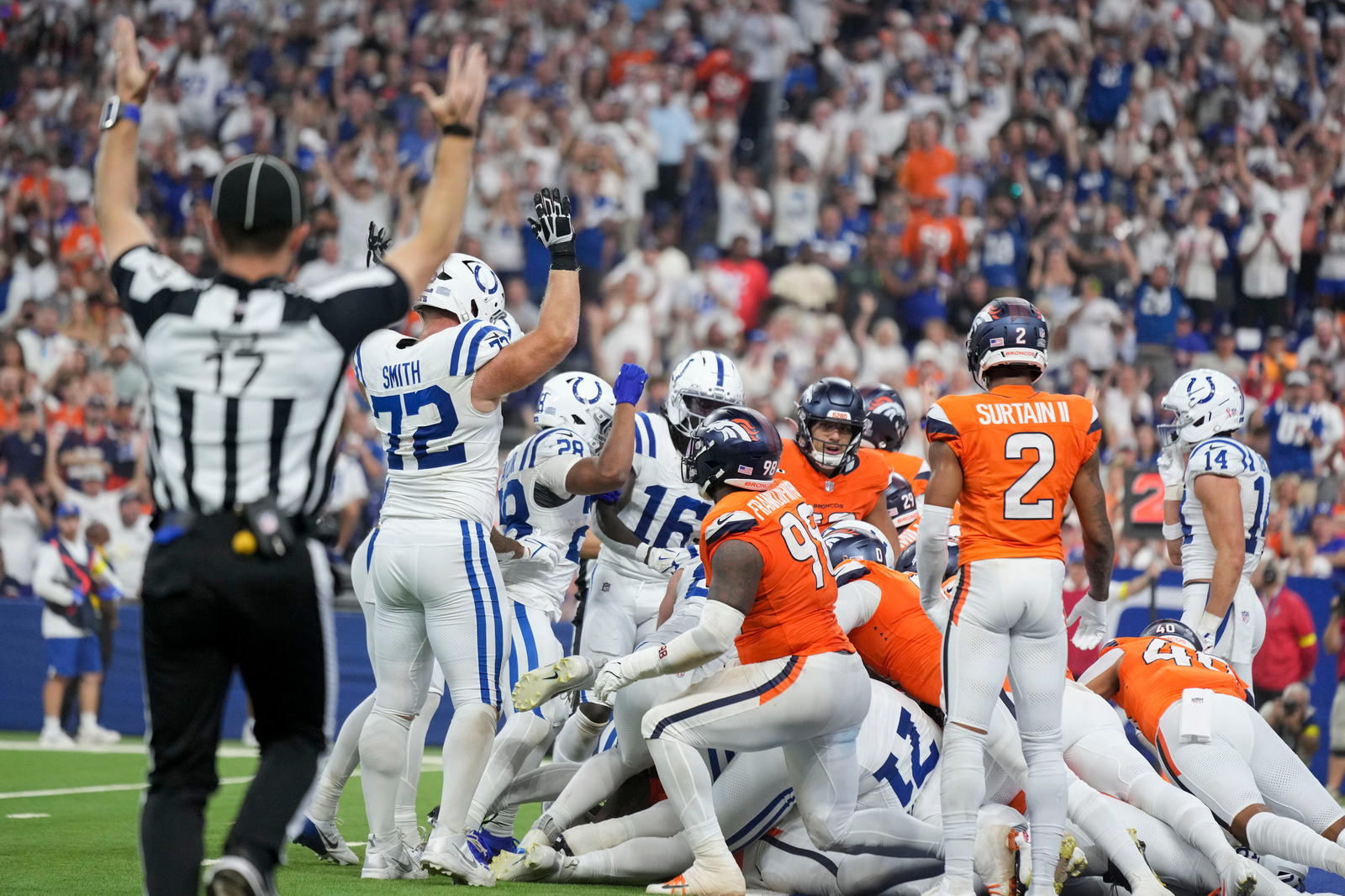 Indianapolis Colts quarterback Daniel Jones (17) rushes in for a touchdown Sunday, Sept. 14, 2025, during a game against the Denver Broncos at Lucas Oil Stadium in Indianapolis. Mandatory Credit: Grace Hollars/IndyStar