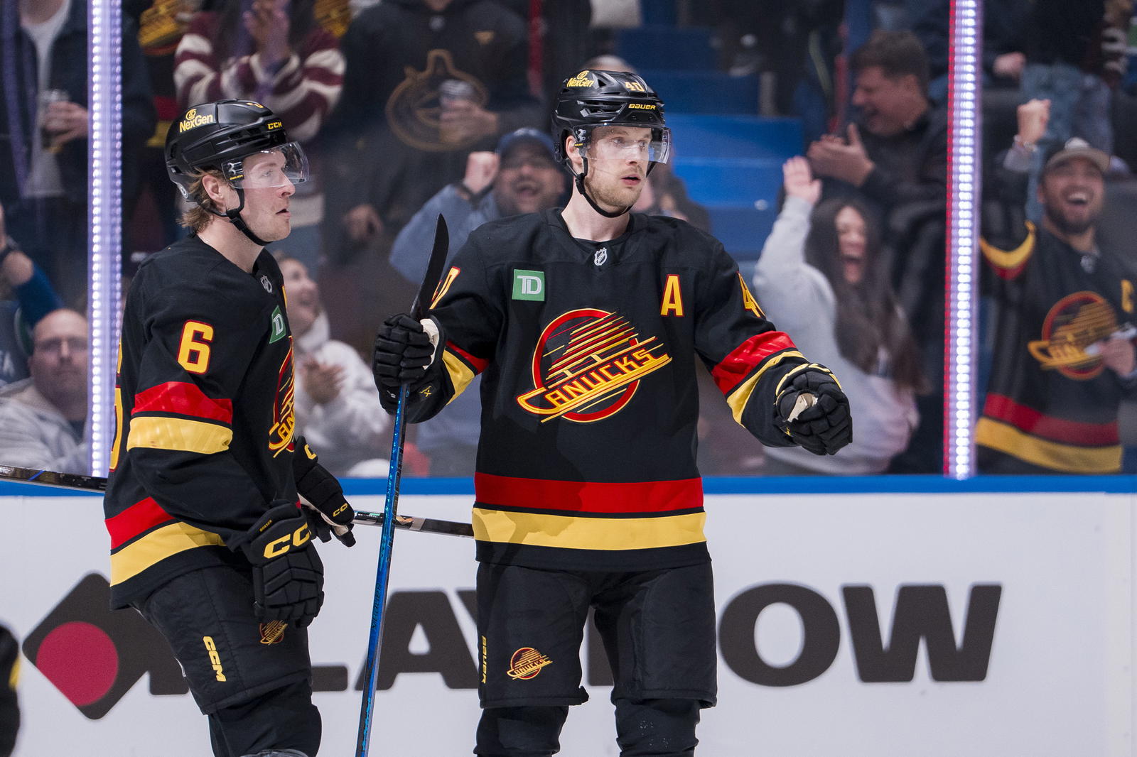 Mar 7, 2025; Vancouver, British Columbia, CAN; Vancouver Canucks forward Brock Boeser (6) celebrates forward Elias Pettersson (40) goal against the Minnesota Wild during the first period at Rogers Arena. Mandatory Credit: Bob Frid-Imagn Images