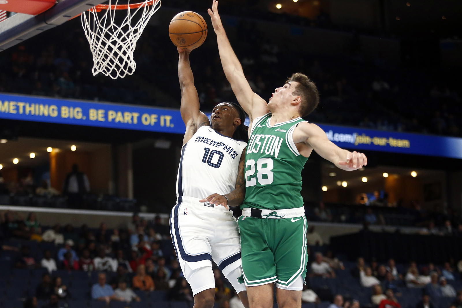 Oct 8, 2025; Memphis, Tennessee, USA; Memphis Grizzlies guard Javon Small (10) drives to the basket as Boston Celtics guard Hugo Gonzalez (28) defends during the fourth quarter at FedExForum. (Petre Thomas/Imagn Images)