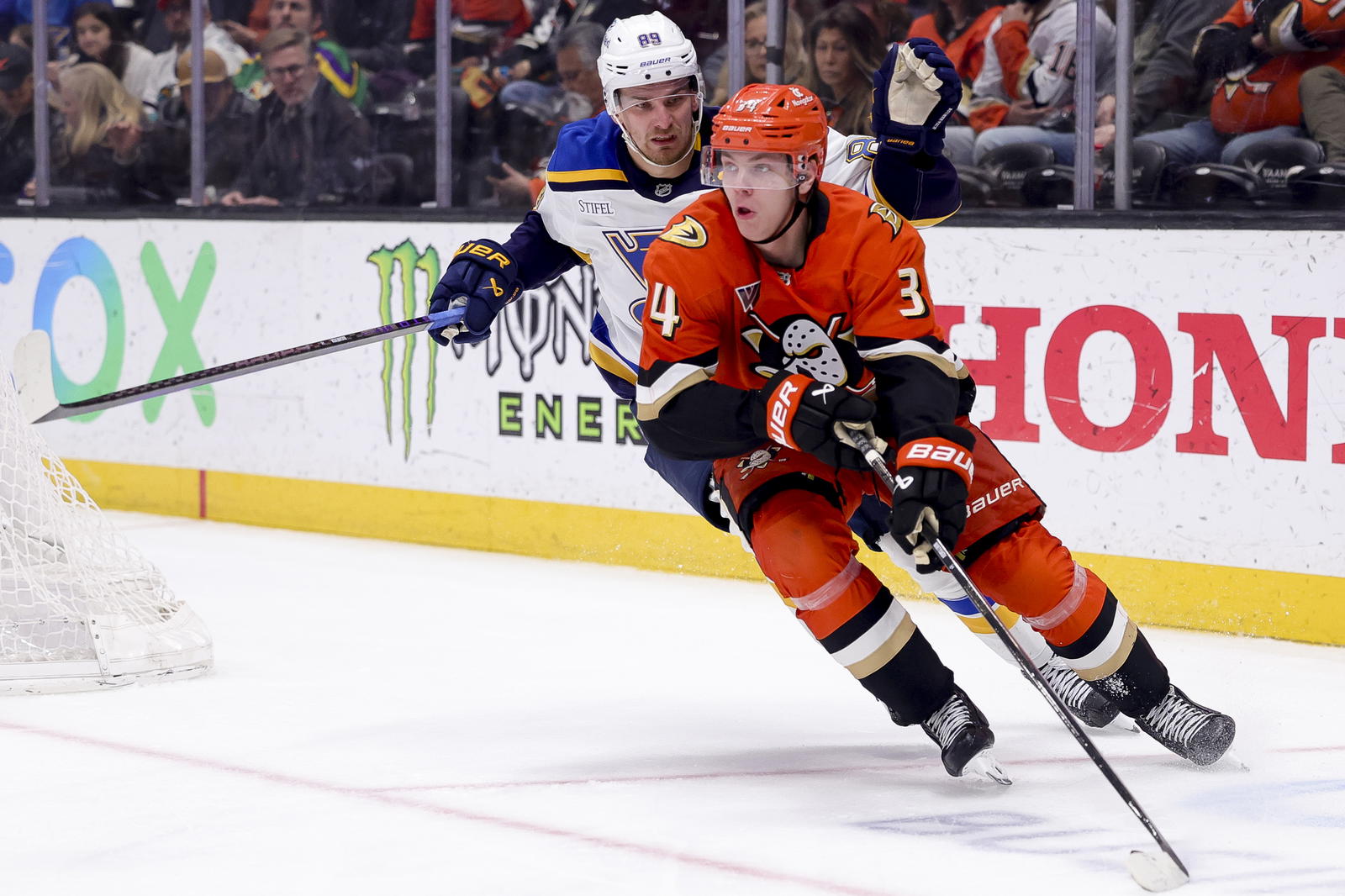 Mar 7, 2025; Anaheim, California, USA; St. Louis Blues left wing Pavel Buchnevich (89) chases Anaheim Ducks defenseman Pavel Mintyukov (34) during the third period at Honda Center. (Ryan Sun-Imagn Images)