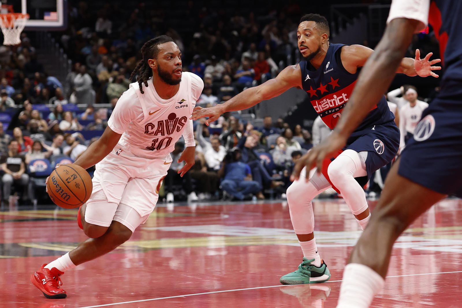 Nov 7, 2025; Washington, District of Columbia, USA; Cleveland Cavaliers guard Darius Garland (10) drives to the basket as Washington Wizards guard CJ McCollum (3) defends in the second half in an Emirates NBA Cup game at Capital One Arena. Mandatory Credit: Geoff Burke-Imagn Images
