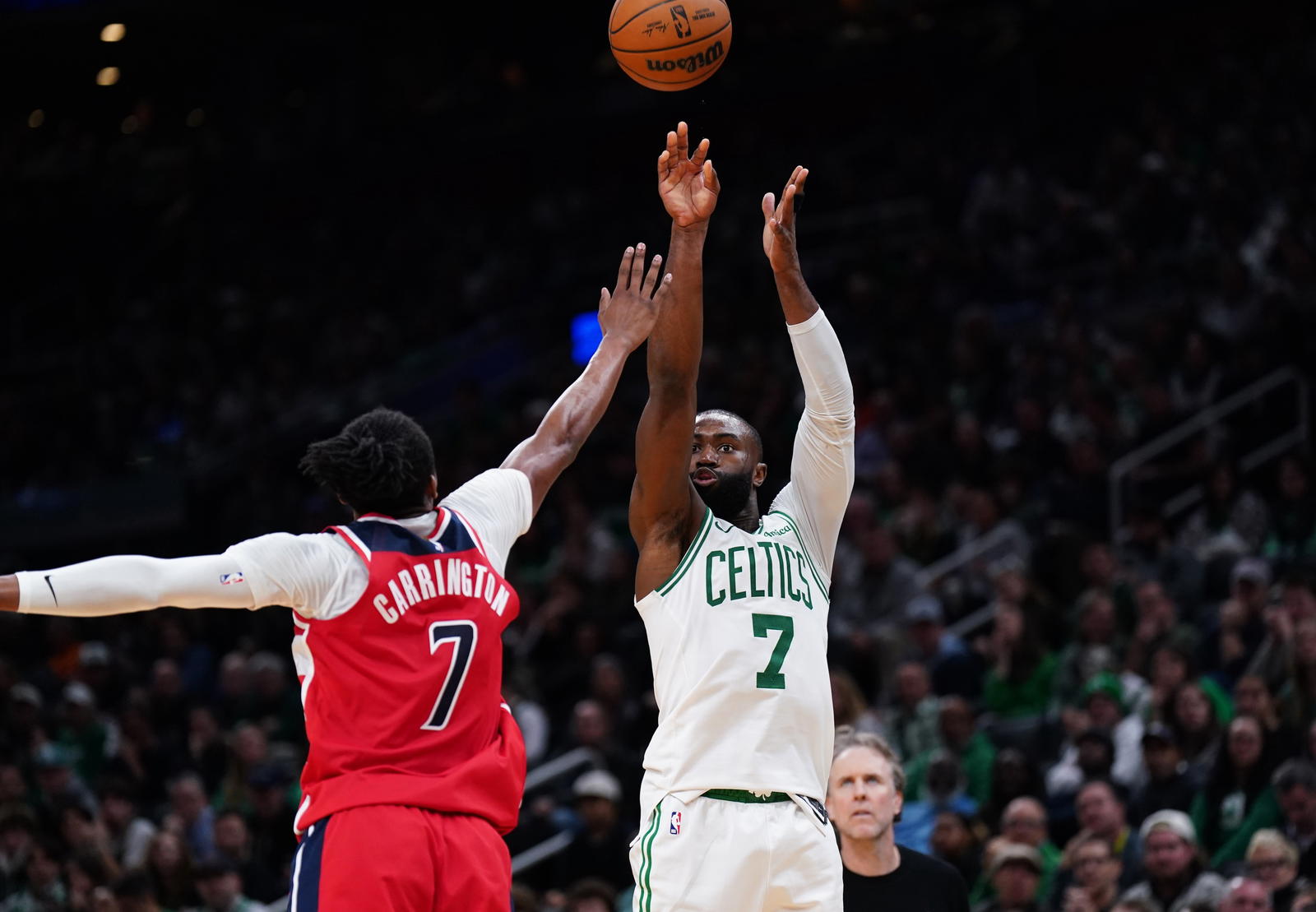 Nov 5, 2025; Boston, Massachusetts, USA; Boston Celtics guard/forward Jaylen Brown (7) shoots the ball against Washington Wizards guard Bub Carrington (7) in the second half at TD Garden. (David Butler II/Imagn Images)