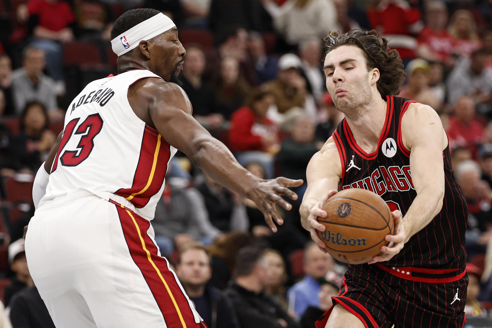 Nov 21, 2025; Chicago, Illinois, USA; Chicago Bulls guard Josh Giddey (3) drives to the basket against Miami Heat center Bam Adebayo (13) during the first half at United Center. Mandatory Credit: Kamil Krzaczynski-Imagn Images