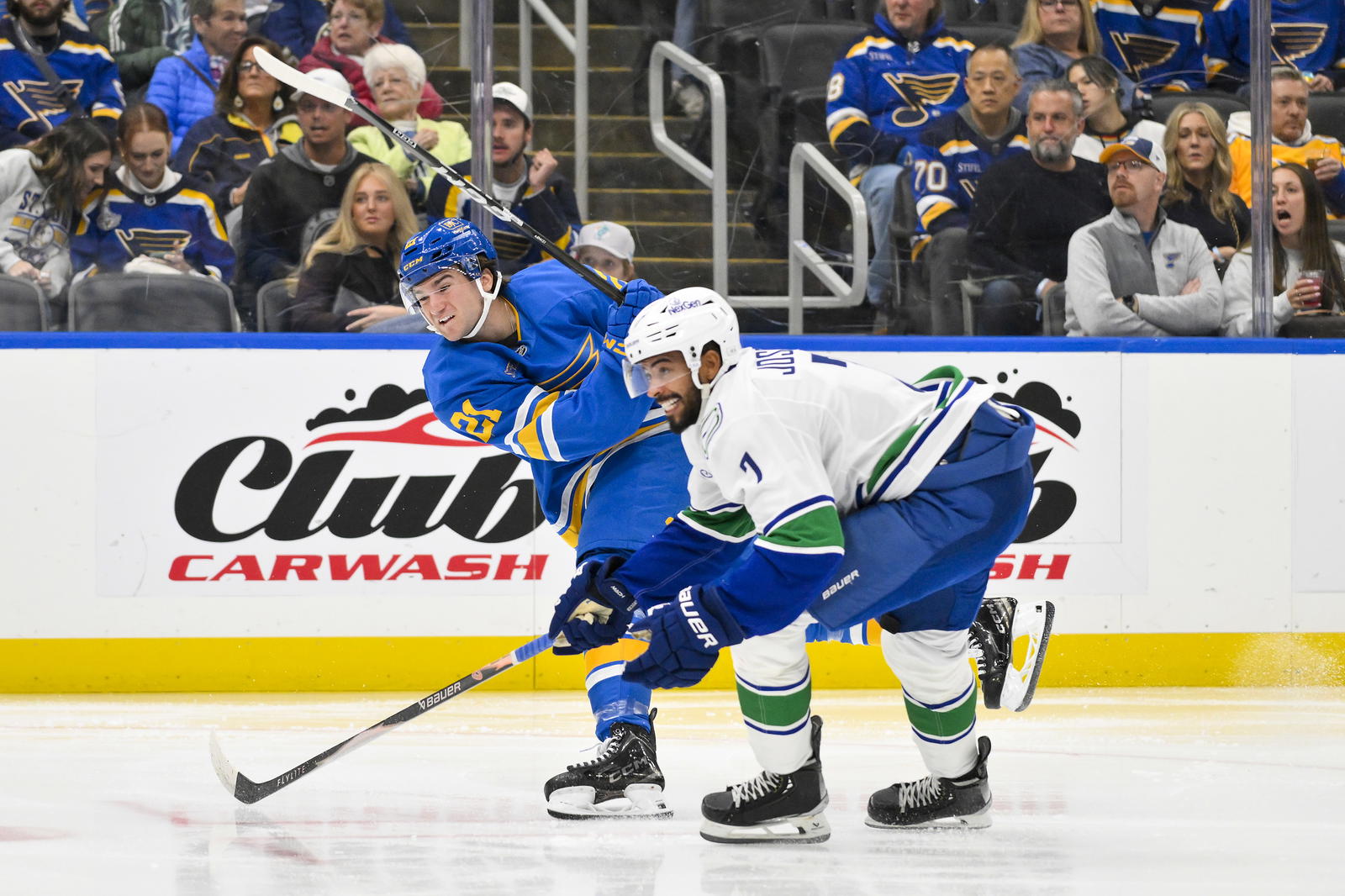 Oct 30, 2025; St. Louis, Missouri, USA; St. Louis Blues right wing Jimmy Snuggerud (21) shoots and scores against the Vancouver Canucks during the second period at Enterprise Center. Mandatory Credit: Jeff Curry-Imagn Images