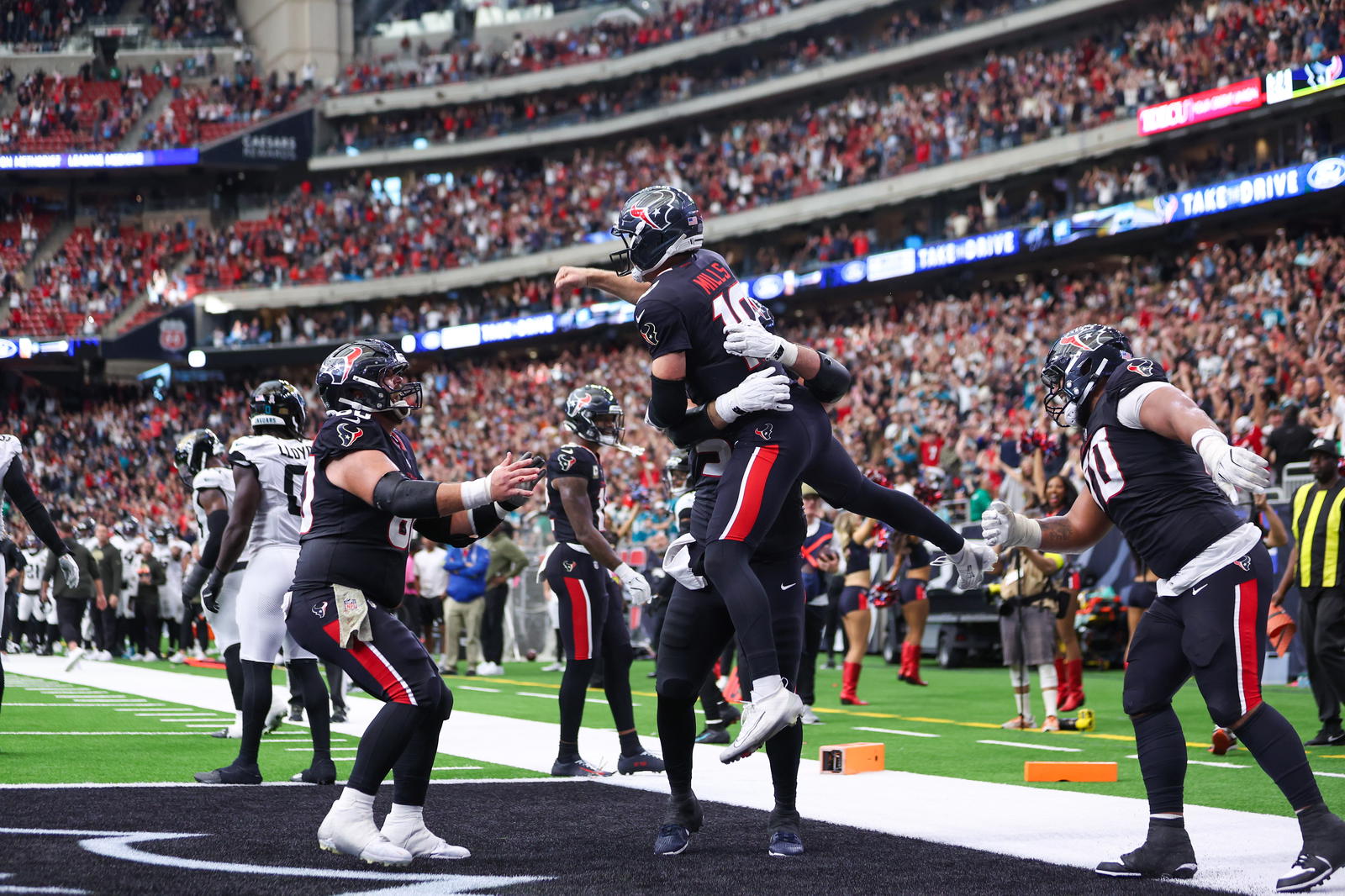 Texans QB Davis Mills Celebrates With Teammates After Scoring The Texans Go Ahead Touchdown Photo - Thomas Shea/Imagn Images