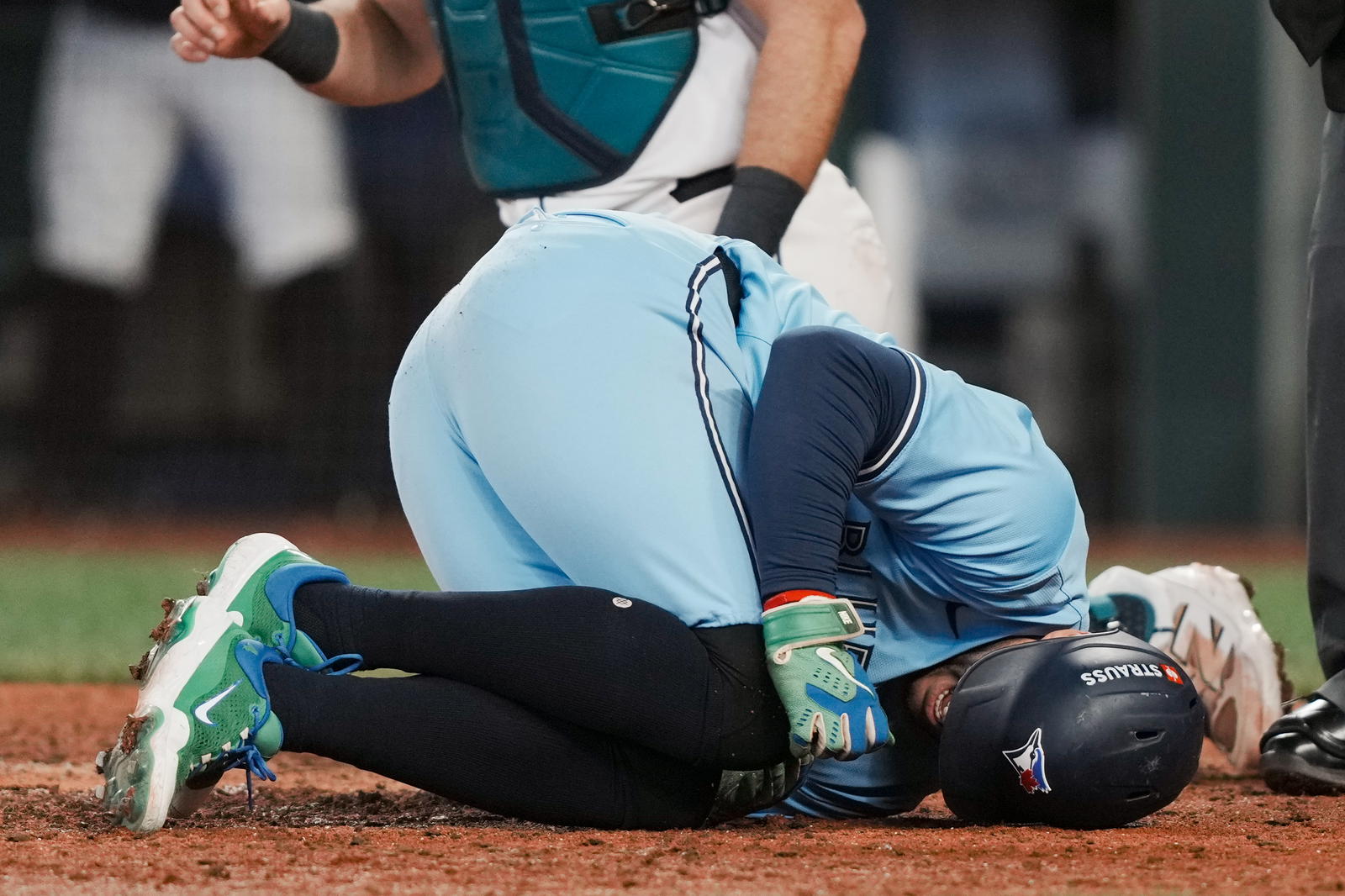 Toronto Blue Jays designated hitter George Springer (4) reacts after being hit by a pitch against the Seattle Mariners in the seventh inning during game five of the ALCS round for the 2025 MLB playoffs at T-Mobile Park. Stephen Brashear-Imagn Images