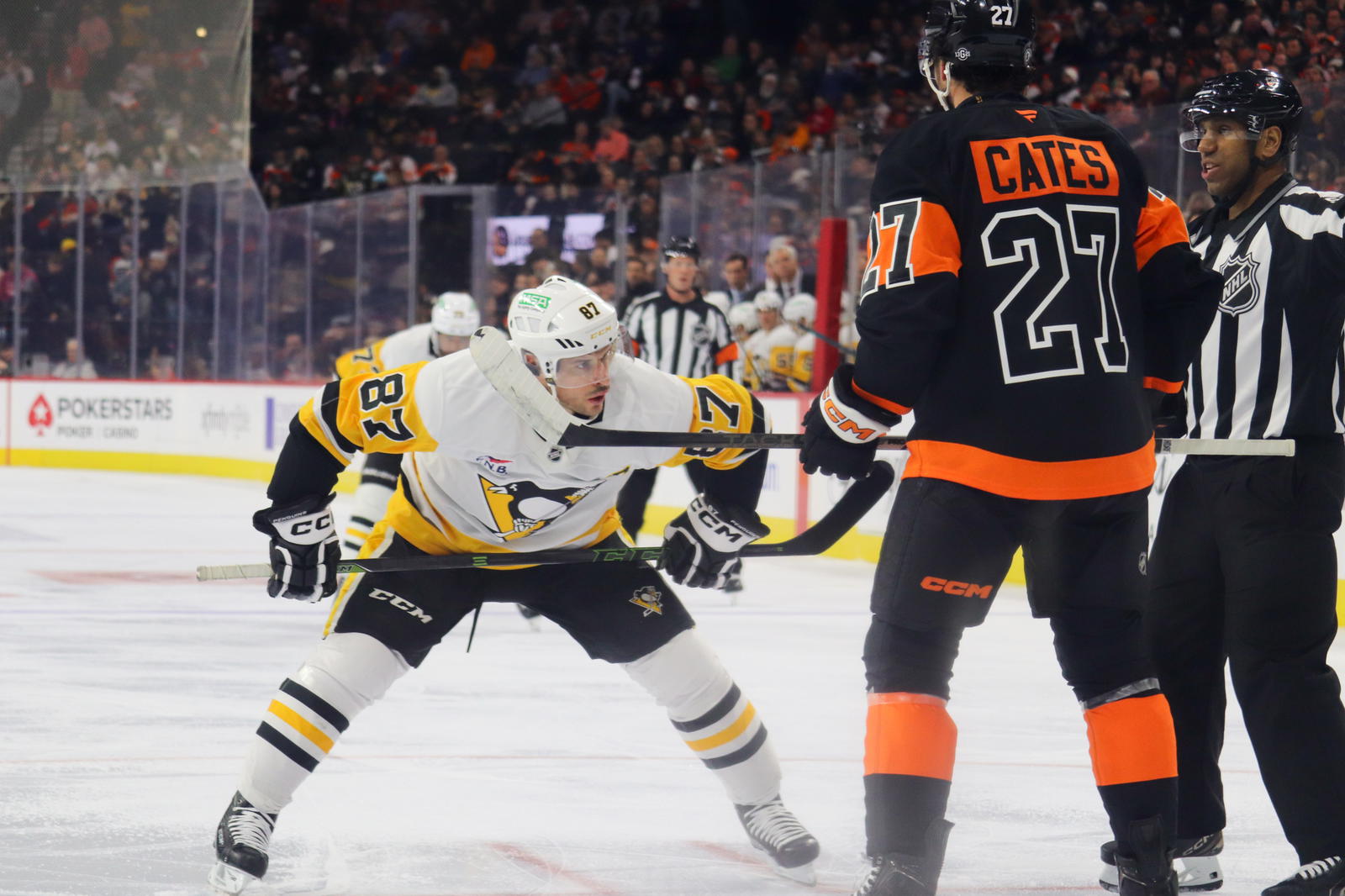 Philadelphia Flyers center Noah Cates (27) prepares to take a faceoff against Pittsburgh Penguins center Sidney Crosby (87). (Megan DeRuchie-The Hockey News)
