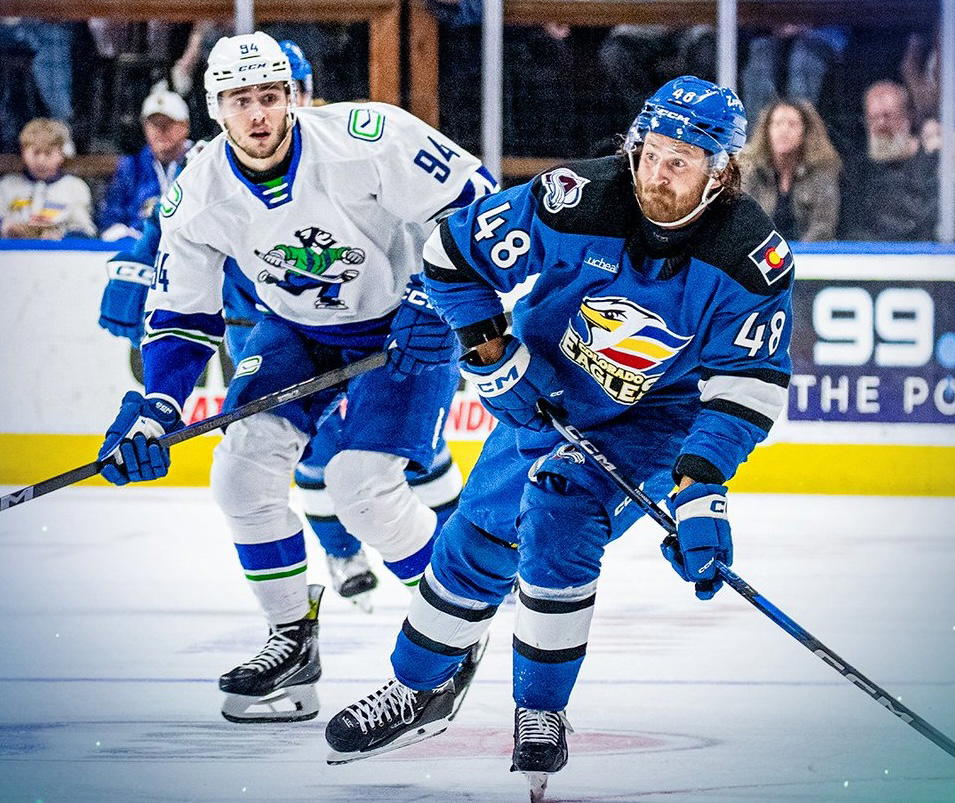 Abbotsford Canucks' Linus Karlsson (94) chases Colorado Eagles' Tye Felhaber (48). (Photo by @abbycanucks/X)