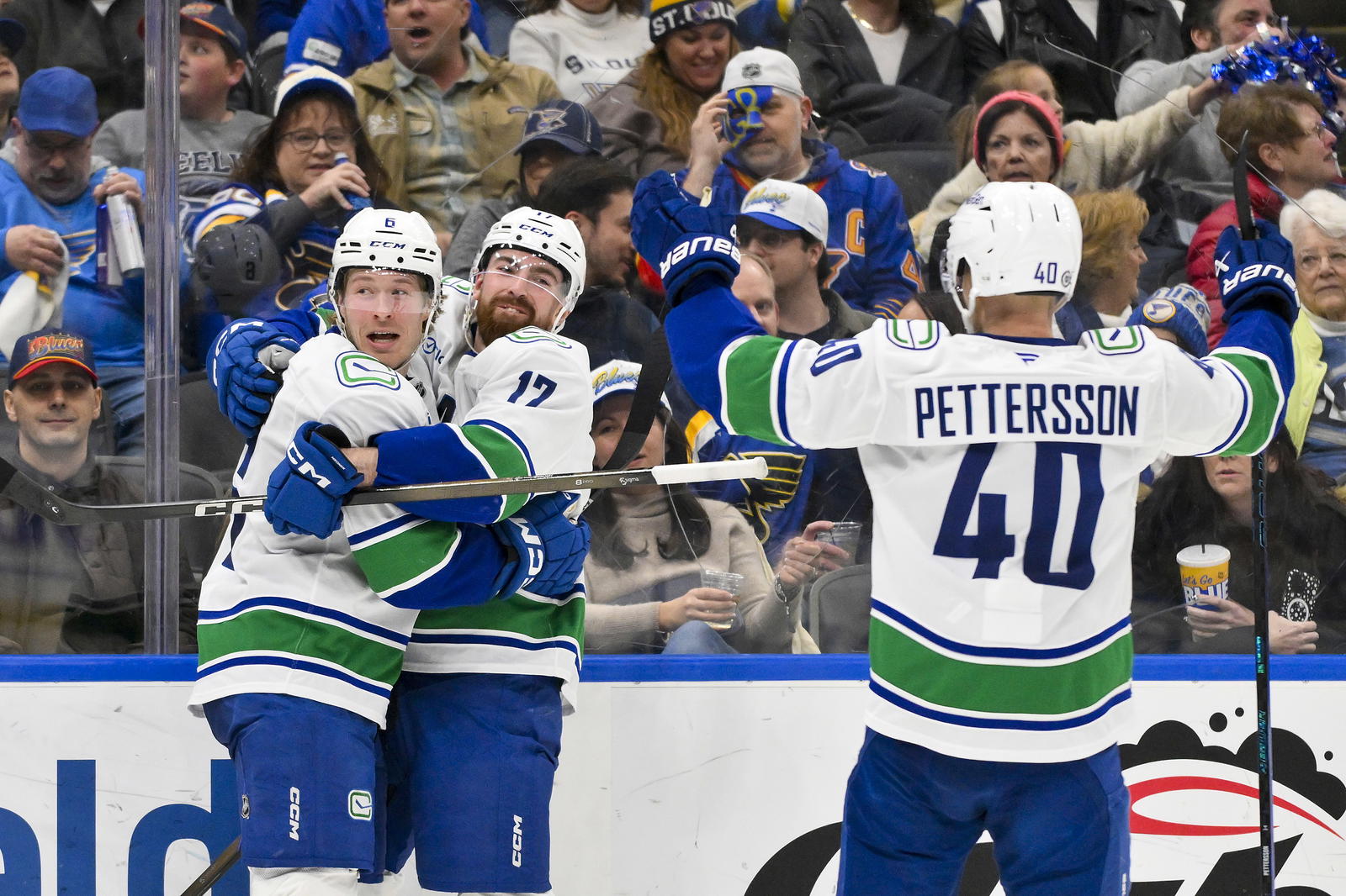 Mar 20, 2025; St. Louis, Missouri, USA; Vancouver Canucks right wing Brock Boeser (6) celebrates with defenseman Filip Hronek (17) and center Elias Pettersson (40) after scoring against the St. Louis Blues during the third period at Enterprise Center. Mandatory Credit: Jeff Curry-Imagn Images