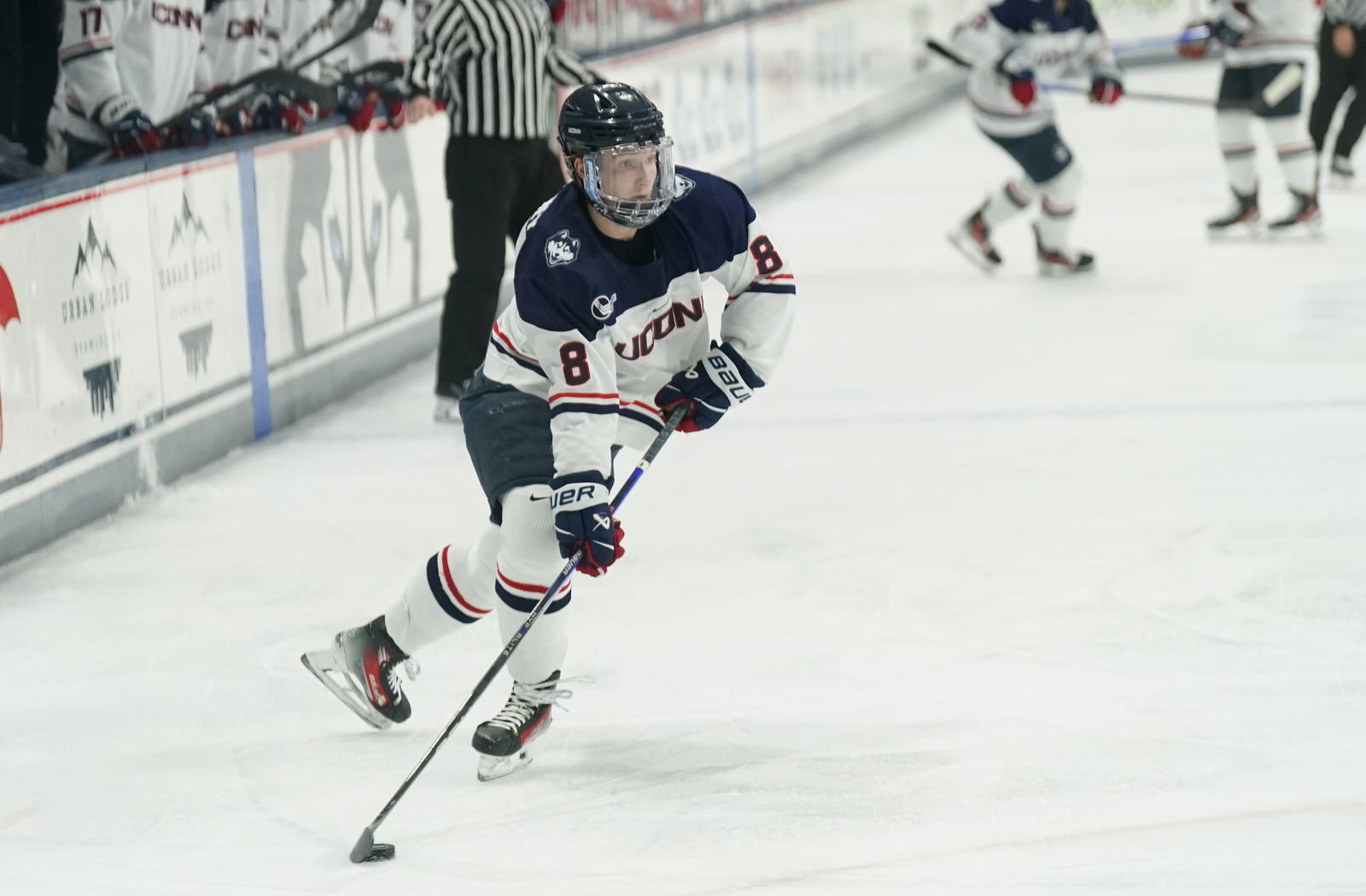 Feb 25, 2025; Storrs, CT, USA; UConn forward Joey Muldowney (8) looks for an opening against Boston University during the second period at Toscano Family Ice Forum. Mandatory Credit: David Butler II-Imagn Images