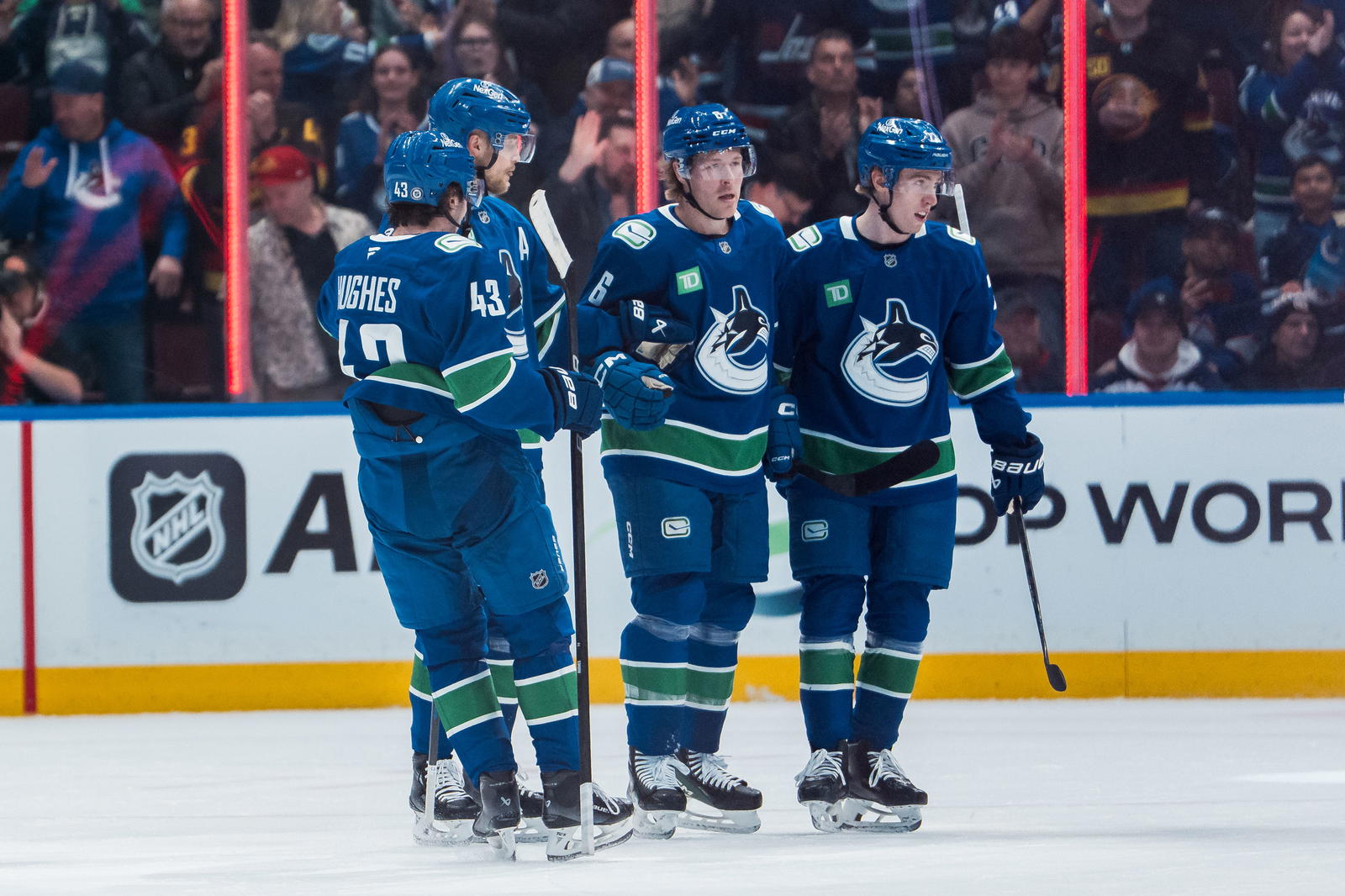 Mar 18, 2025; Vancouver, British Columbia, CAN; Vancouver Canucks defenseman Quinn Hughes (43) and forward Elias Pettersson (40) and forward Brock Boeser (6) and forward Jonathan Lekkerimaki (23) celebrate Boeser’s goal against the Winnipeg Jets n the first period at Rogers Arena. Mandatory Credit: Bob Frid-Imagn Images