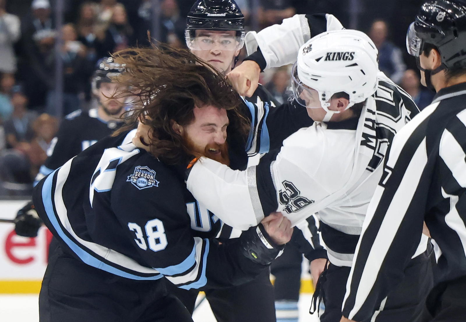 Sep 23, 2024; Salt Lake City, Utah, USA; Utah Hockey Club forward Liam O’brien (38) and Los Angeles Kings forward Jeff Malott (39) fight during the first period at Delta Center. Mandatory Credit: Rob Gray-Imagn Images