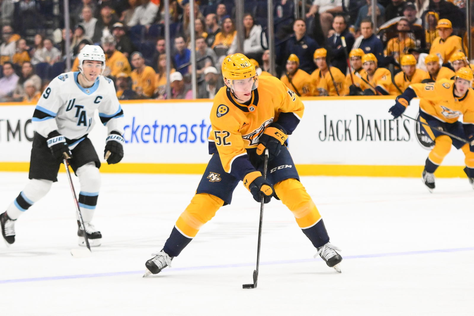 Apr 14, 2025; Nashville, Tennessee, USA; Nashville Predators right wing Matthew Wood (52) skates with the puck against the Utah Hockey Club during the third period at Bridgestone Arena. Steve Roberts-Imagn Images