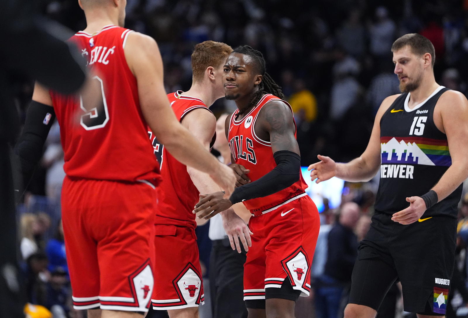 Chicago Bulls guard/forward Kevin Huerter (13) and guard Ayo Dosunmu (11) celebrate defeating the Denver Nuggets at Ball Arena.&nbsp;Ron Chenoy-Imagn Images