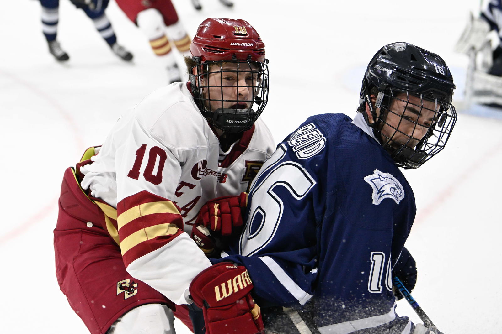 Feb 28, 2025; Chestnut Hill, MA, USA; Boston College forward James Hagens (10) skates against New Hampshire defenseman Luke Reid (16) during the first period at Conte Forum. Mandatory Credit: Eric Canha-Imagn Images