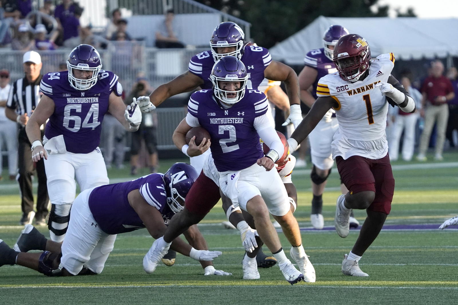 Oct 4, 2025; Evanston, Illinois, USA; Northwestern Wildcats quarterback Ryan Boe (2) runs the ball against the ULM Warhawks during the second half at Northwestern Medicine Field at Martin Stadium. Mandatory Credit: David Banks-Imagn Images
