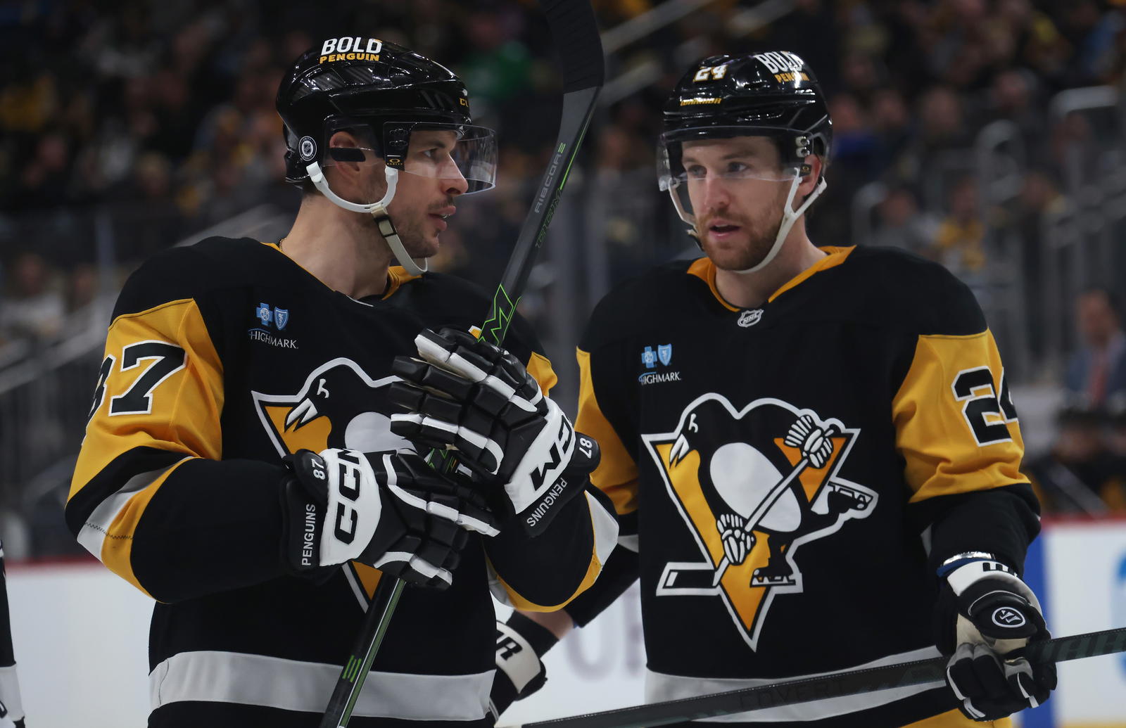 Mar 13, 2025; Pittsburgh, Pennsylvania, USA; Pittsburgh Penguins center Sidney Crosby (87) talks with defenseman Matt Grzelcyk (24) against the St. Louis Blues during the third period at PPG Paints Arena. (Charles LeClaire-Imagn Images)