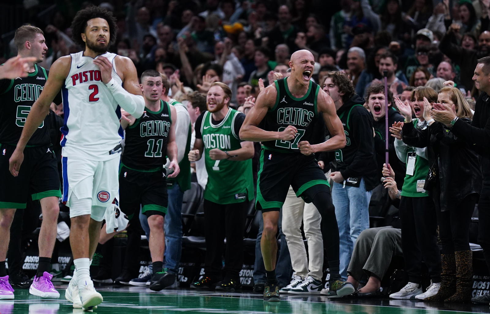 Nov 26, 2025; Boston, Massachusetts, USA; Boston Celtics guard Jordan Walsh (27) and Detroit Pistons guard Cade Cunningham (2) react after an out of bound ball called in the Celtics favor in the last seconds of the fourth quarter at TD Garden. (David Butler II/Imagn Images)