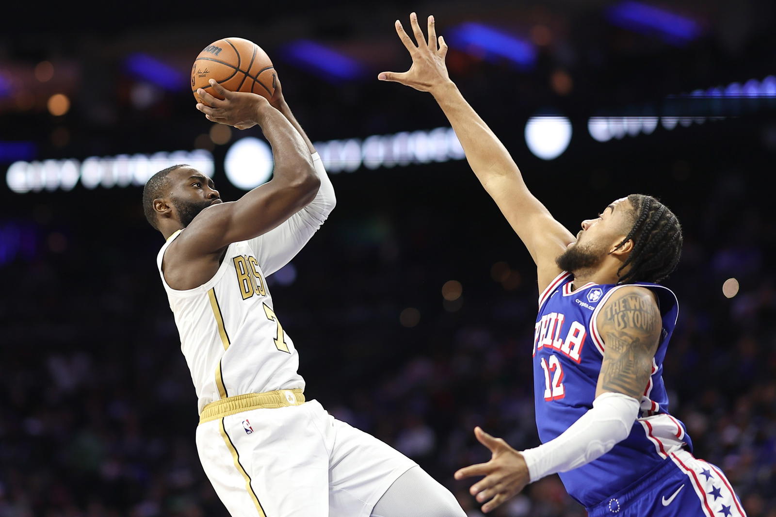 Nov 11, 2025; Philadelphia, Pennsylvania, USA; Boston Celtics guard Jaylen Brown (7) shoots the ball against Philadelphia 76ers forward Trendon Watford (12) during the second quarter at Xfinity Mobile Arena. (Bill Streicher/Imagn Images)