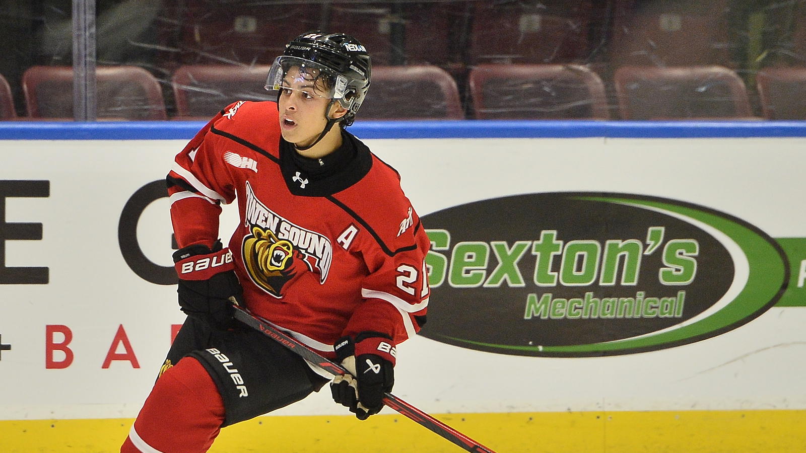 <i>Owen Sound Attack forward Pierce Mbuyi (21). Credit: Terry Wilson/OHL Images</i>