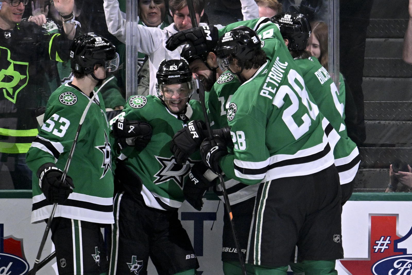 Dallas Stars center Wyatt Johnston (53) and right wing Evgenii Dadonov (63) and left wing Jamie Benn (14) and defenseman Alexander Petrovic (28) celebrate the game tying goal scored by Dadonov against the Colorado Avalanche during the third period in game two of the first round of the 2025 Stanley Cup Playoffs at American Airlines Center. Mandatory Credit: Jerome Miron-Imagn Images