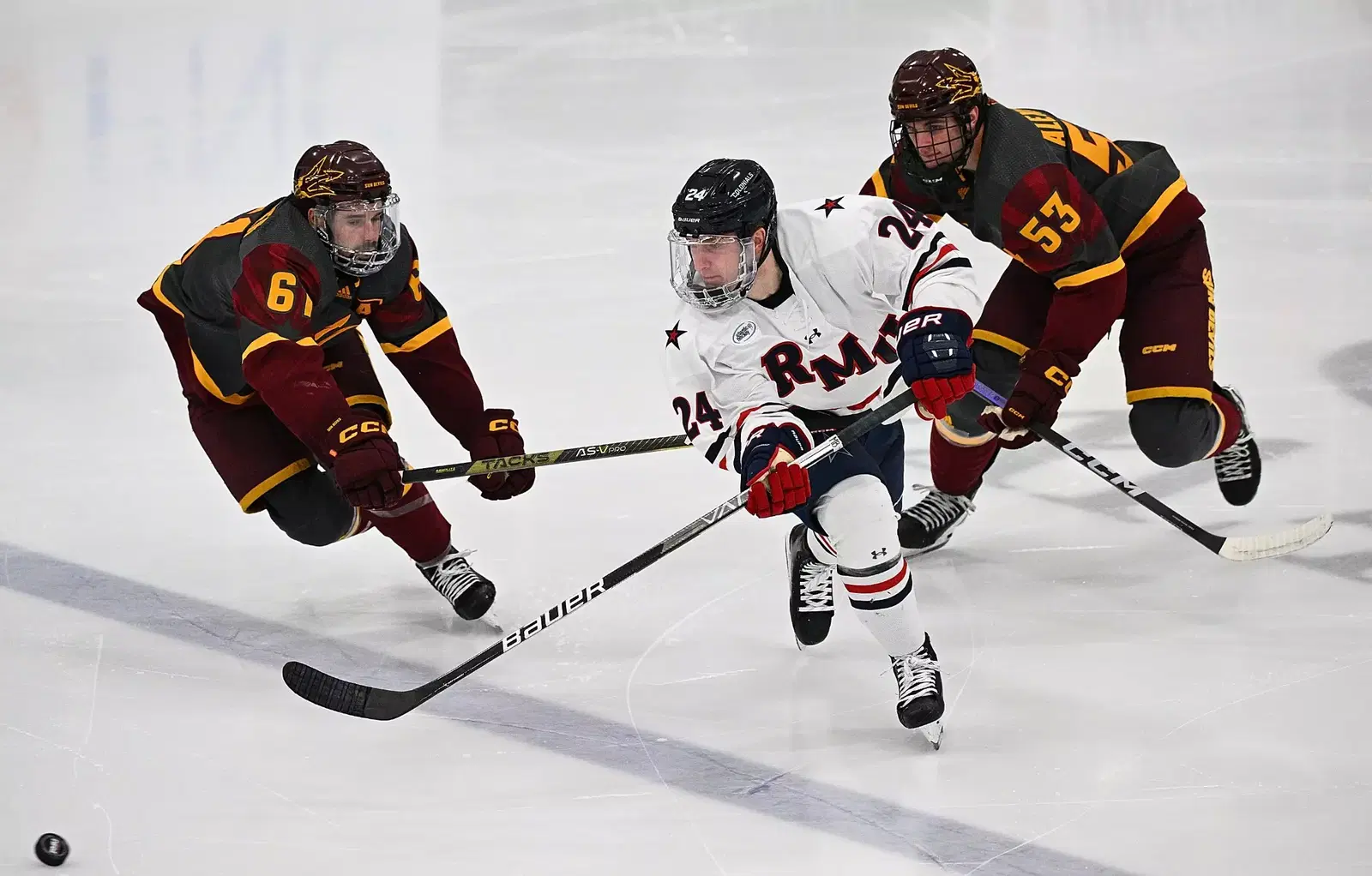 #24 Walter Zacher chases down the puck in a game against Arizona State. - © Justin Berl - RMU Athletics