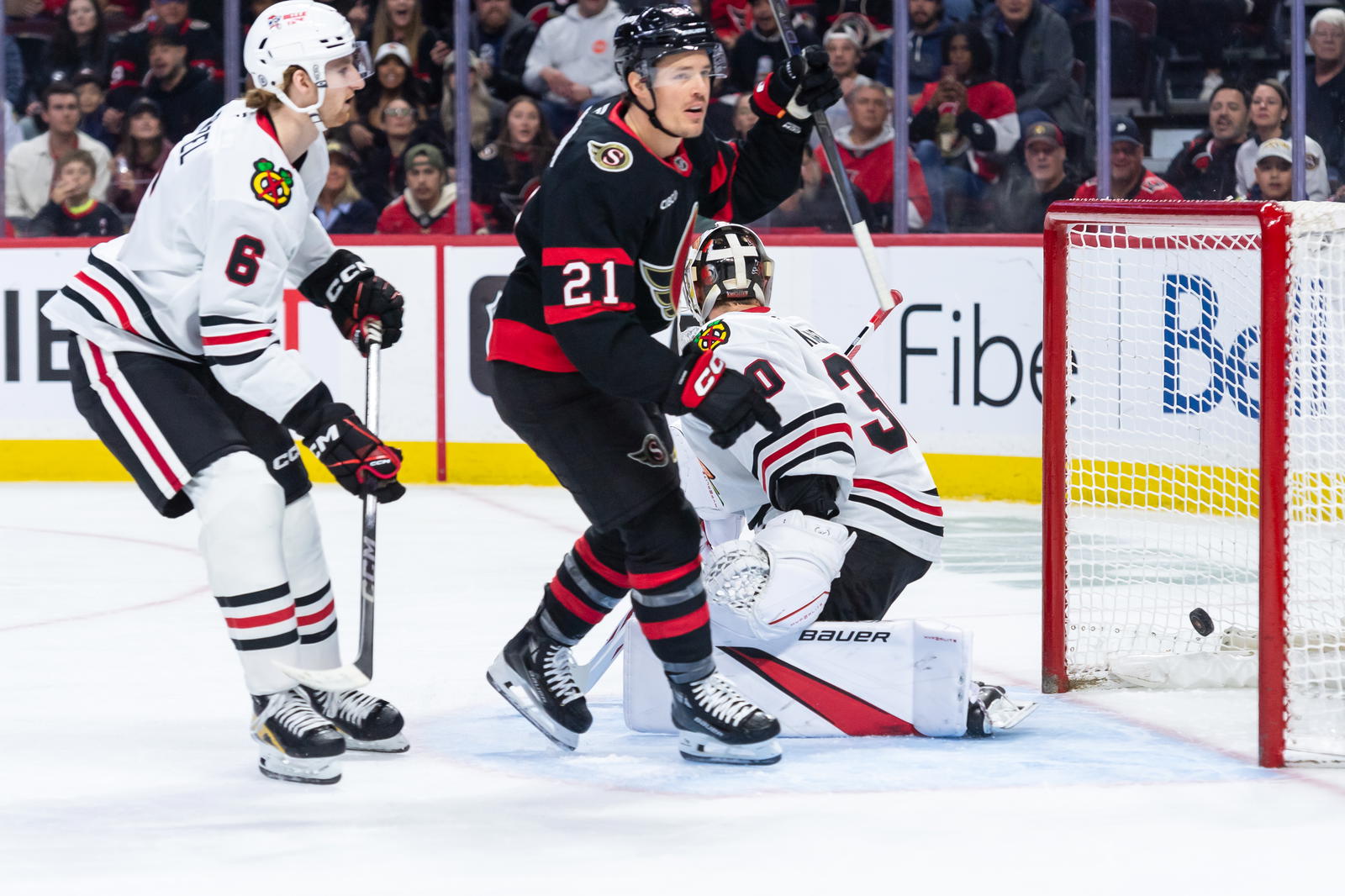April 13, 2025; Ottawa, Ontario, CAN; Philadelphia Flyers goalie Ivan Fedotov (82) makes a save in front of Ottawa Senators center Nick Cousins (21) in the first period at the Canadian Tire Centre. Mandatory Credit: Marc DesRosiers-Imagn Images.