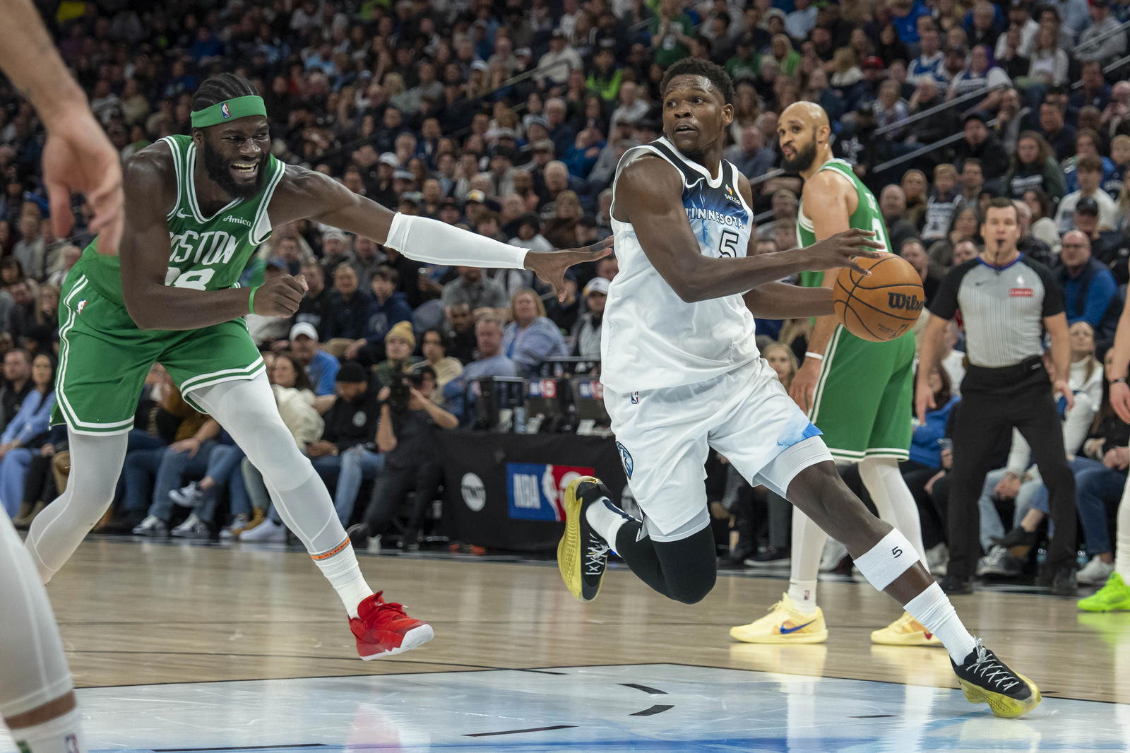 Minnesota Timberwolves guard Anthony Edwards (5) drives past Boston Celtics center Neemias Queta (88) in the second half at Target Center.&nbsp;Jesse Johnson-Imagn Images