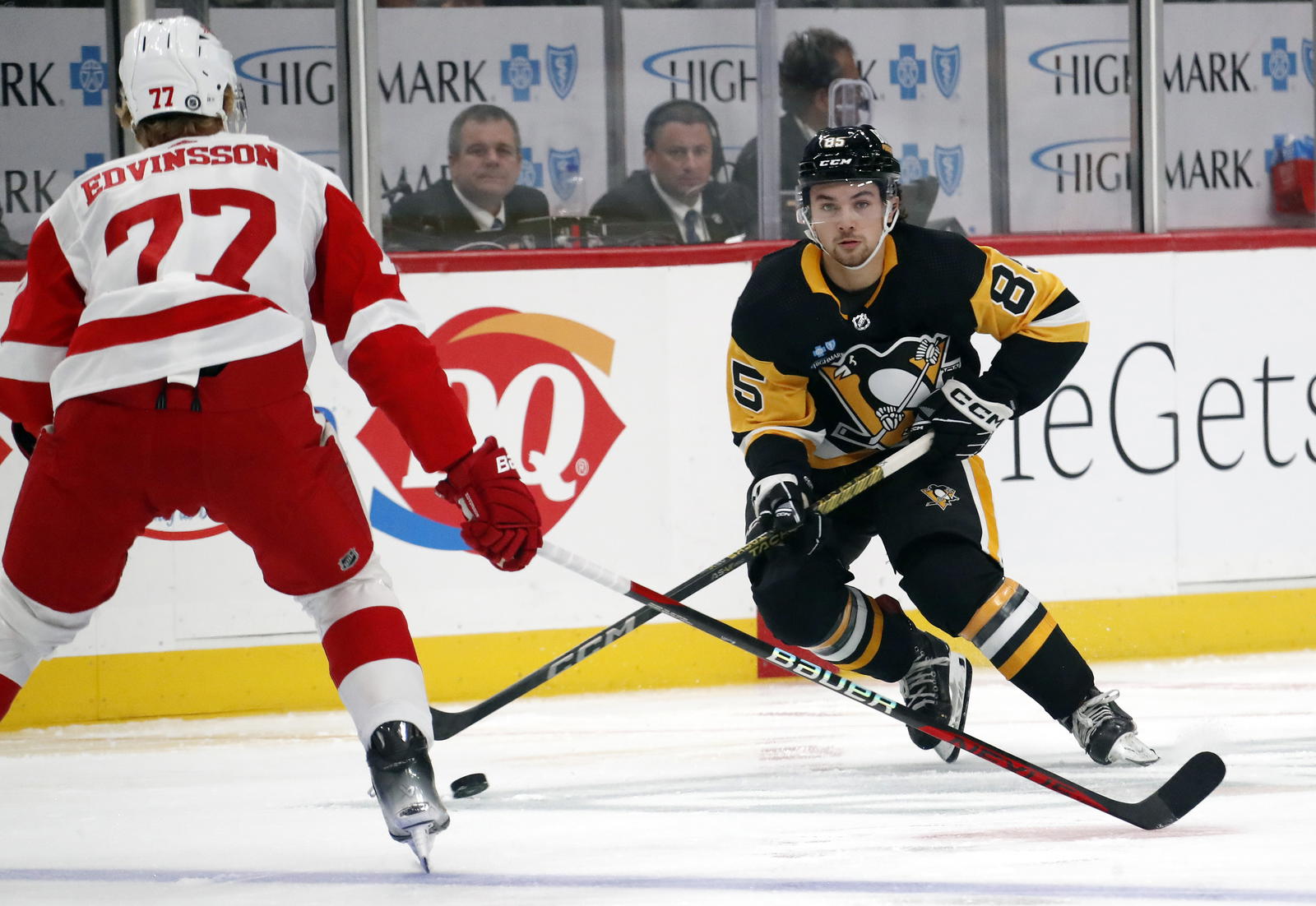 Oct 4, 2023; Pittsburgh, Pennsylvania, USA; Pittsburgh Penguins right wing Avery Hayes (85) moves the puck as Detroit Red Wings defenseman Simon Edvinsson (77) defends during the first period against at PPG Paints Arena. Mandatory Credit: Charles LeClaire-Imagn Images