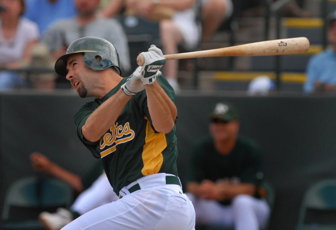 Mar 20, 2007; Phoenix, AZ, USA; Oakland Athletics third baseman (2) Lou Merloni hits a home run against the Chicago White Sox at Phoenix Municipal Stadium in Phoenix, AZ. (Mark J. Rebilas/Imagn Images)