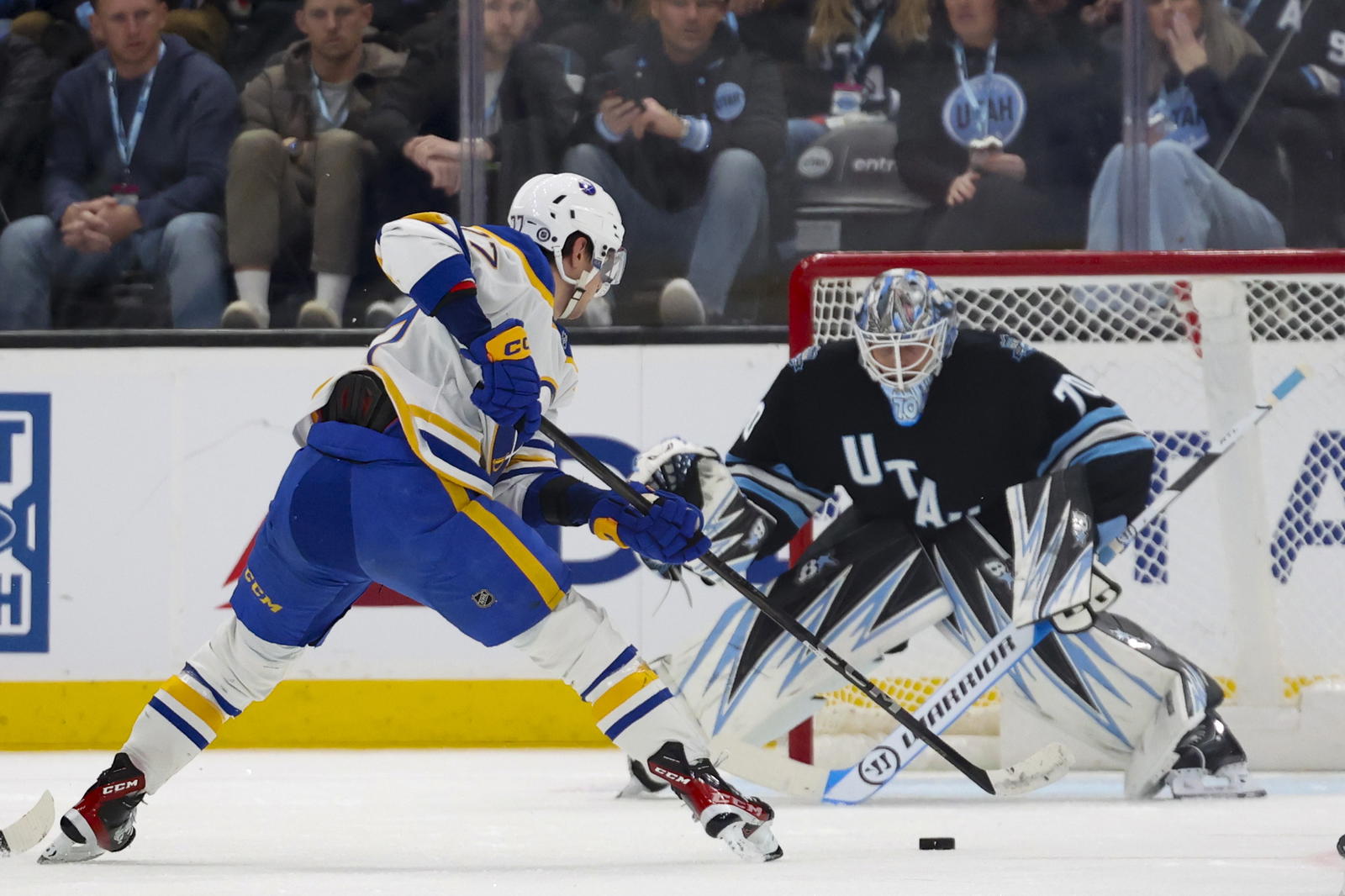 Mar 20, 2025; Salt Lake City, Utah, USA; Buffalo Sabres right wing JJ Peterka (77) looks for a shot against Utah Hockey Club goaltender Karel Vejmelka (70) during the second period at Delta Center. Mandatory Credit: Rob Gray-Imagn Images<br>