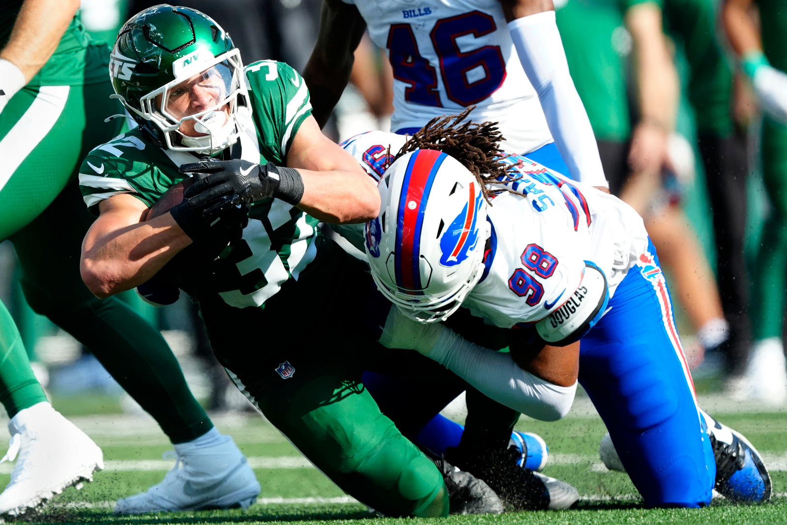 New York Jets running back Isaiah Davis (32) is tackled by Buffalo Bills defensive tackle T.J. Sanders (98), Sunday, September 14, 2025, in East Rutherford. Kevin R. Wexler-NorthJersey.com via Imagn Images
