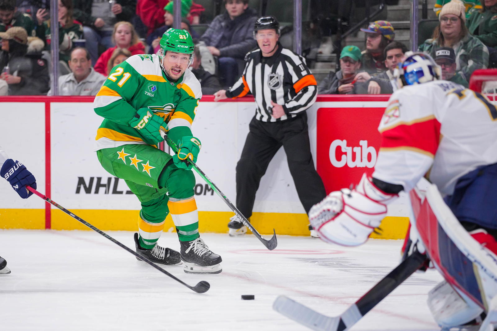 Dec 18, 2024; Saint Paul, Minnesota, USA; Minnesota Wild center Brendan Gaunce (21) shoots against the Florida Panthers in the second period at Xcel Energy Center. Mandatory Credit: Brad Rempel-Imagn Images.