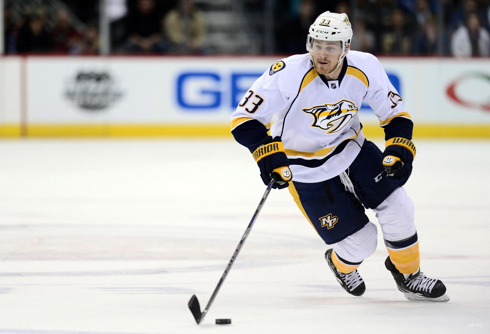 Nov 6, 2013; Denver, CO, USA; Nashville Predators center Colin Wilson (33) controls the puck in the third period against the Colorado Avalanche at the Pepsi Center. The Predators defeated the Avalanche 6-4. Mandatory Credit: Ron Chenoy-Imagn Images