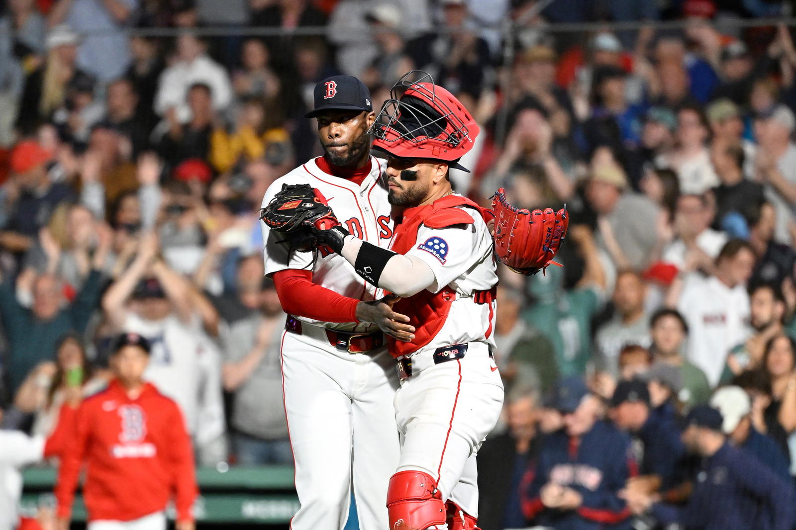 Jul 10, 2025; Boston, Massachusetts, USA; Boston Red Sox relief pitcher Aroldis Chapman (44) and catcher Carlos Narvaez (75) celebrate beating the Tampa Bay Rays at Fenway Park. (Eric Canha/Imagn Images)