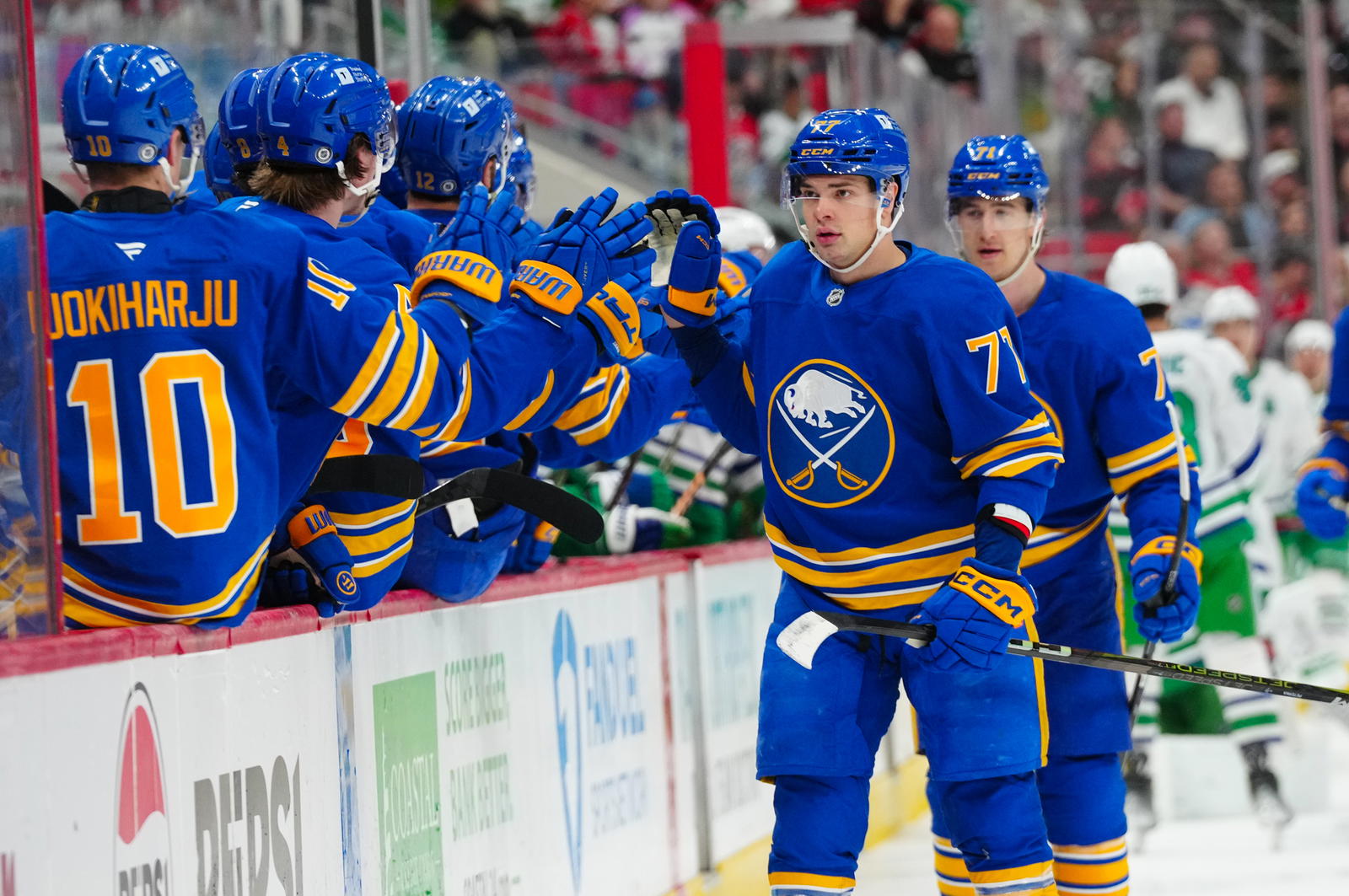 Feb 27, 2025; Raleigh, North Carolina, USA; Buffalo Sabres right wing JJ Peterka (77) celebrates his goal against the Carolina Hurricanes during the third period at Lenovo Center. Mandatory Credit: James Guillory-Imagn Images.