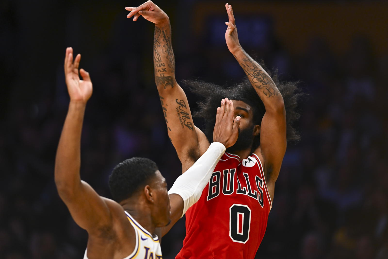 Mar 22, 2025; Los Angeles, California, USA; Los Angeles Lakers forward Rui Hachimura (28) attempts to block against Chicago Bulls guard Coby White (0) during the second half at Crypto.com Arena. Mandatory Credit: Jonathan Hui-Imagn Images
