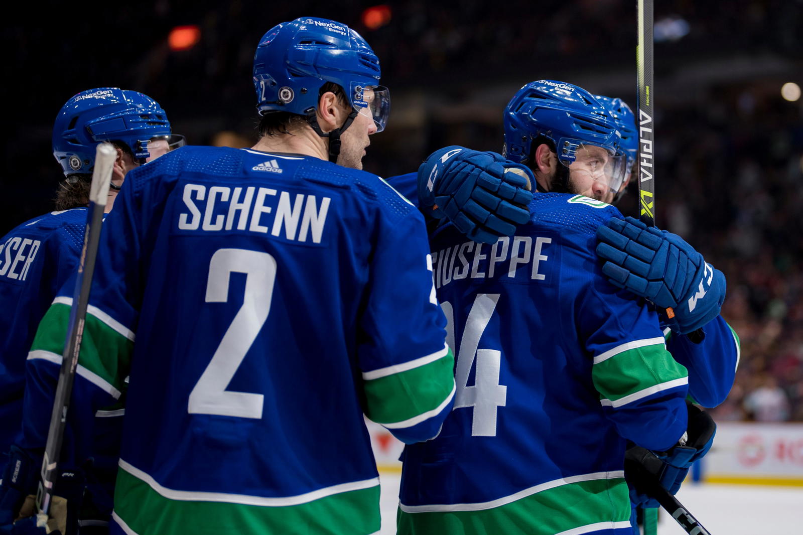 Feb 18, 2023; Vancouver, British Columbia, CAN; Vancouver Canucks forward Brock Boeser (6) and defenseman Luke Schenn (2) and forward Phillip Di Giuseppe (34) and defenseman Christian Wolanin (86) celebrate Di Giuseppe s goal against the Philadelphia Flyers in the third period at Rogers Arena. Canucks won 6-2. Mandatory Credit: Bob Frid-Imagn Images