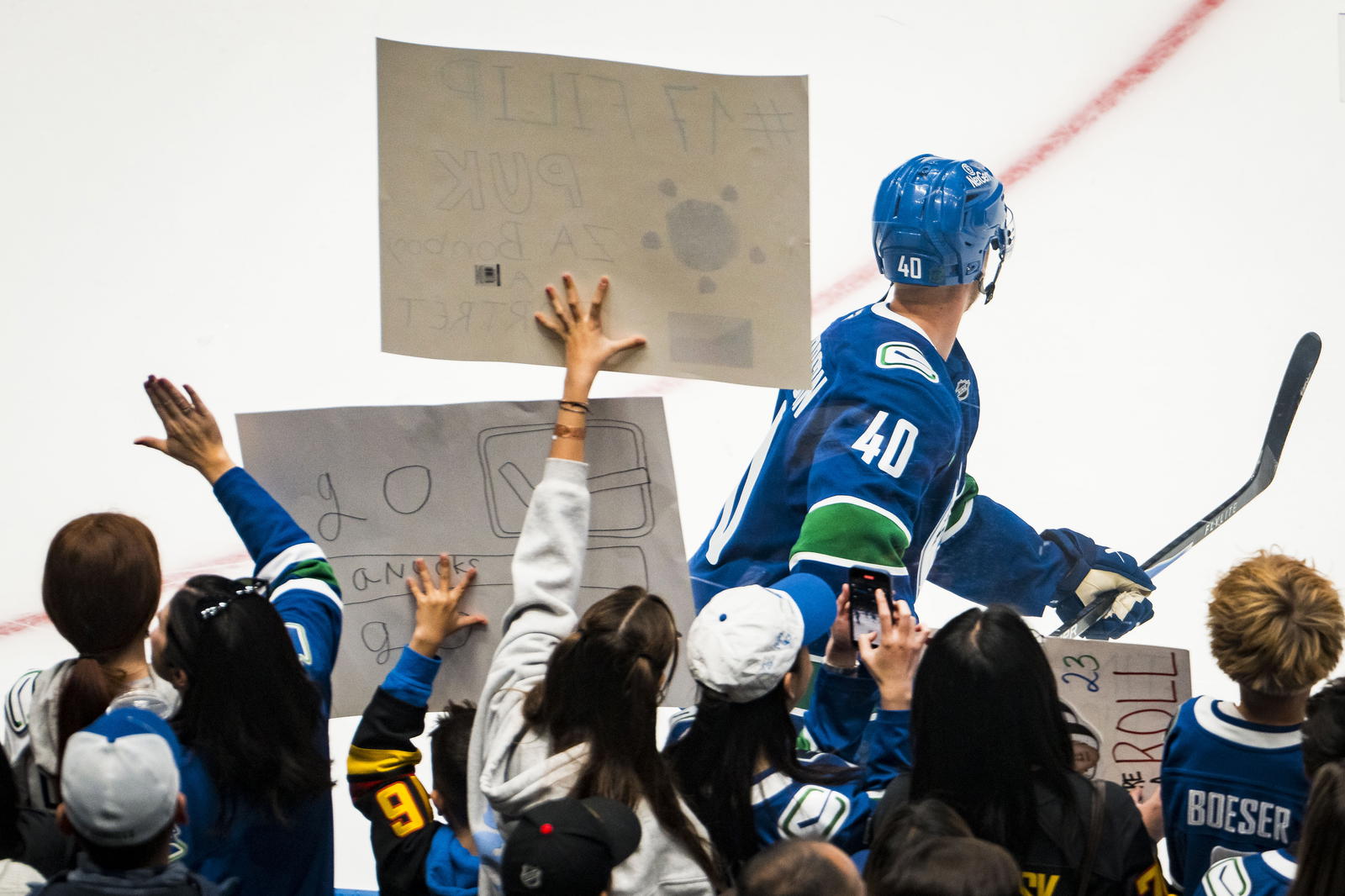 Oct 13, 2025; Vancouver, British Columbia, CAN; Fans cheer for Vancouver Canucks forward Elias Pettersson (40) during warm-up prior to a game against the St. Louis Blues at Rogers Arena. Mandatory Credit: Bob Frid-Imagn Images