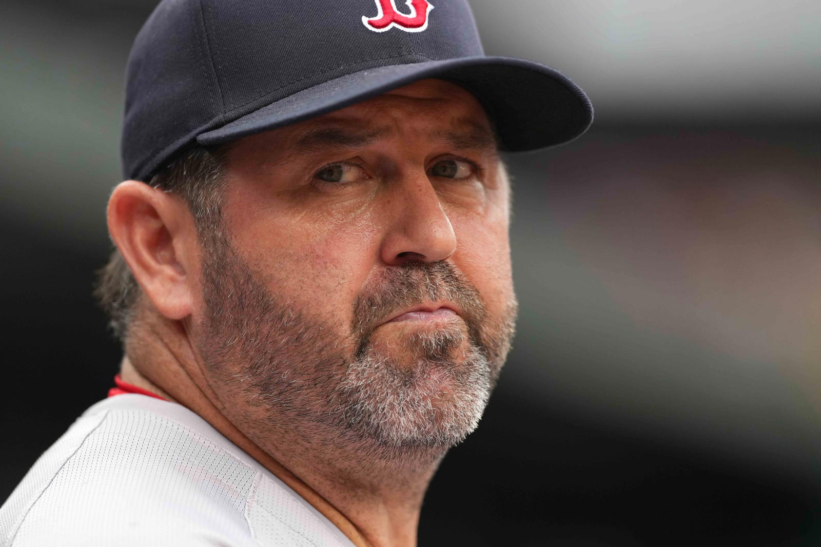 May 27, 2024; Baltimore, Maryland, USA; Boston Red Sox coach Jason Varitek watches third inning action against the Baltimore Orioles at Oriole Park at Camden Yards. (Mitch Stringer/Imagn Images)