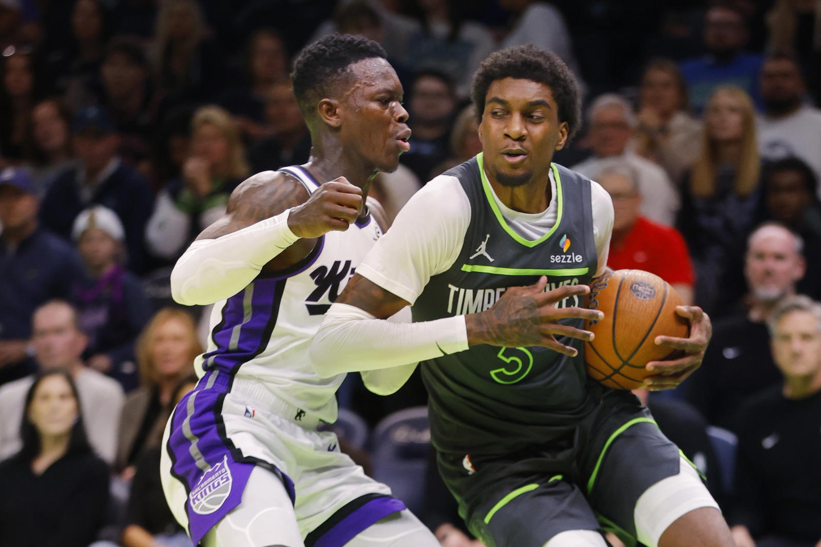 Minnesota Timberwolves forward Jaden McDaniels (3) works around Sacramento Kings guard Dennis Schroder (17) in the first quarter at Target Center.&nbsp;Bruce Kluckhohn-Imagn Images
