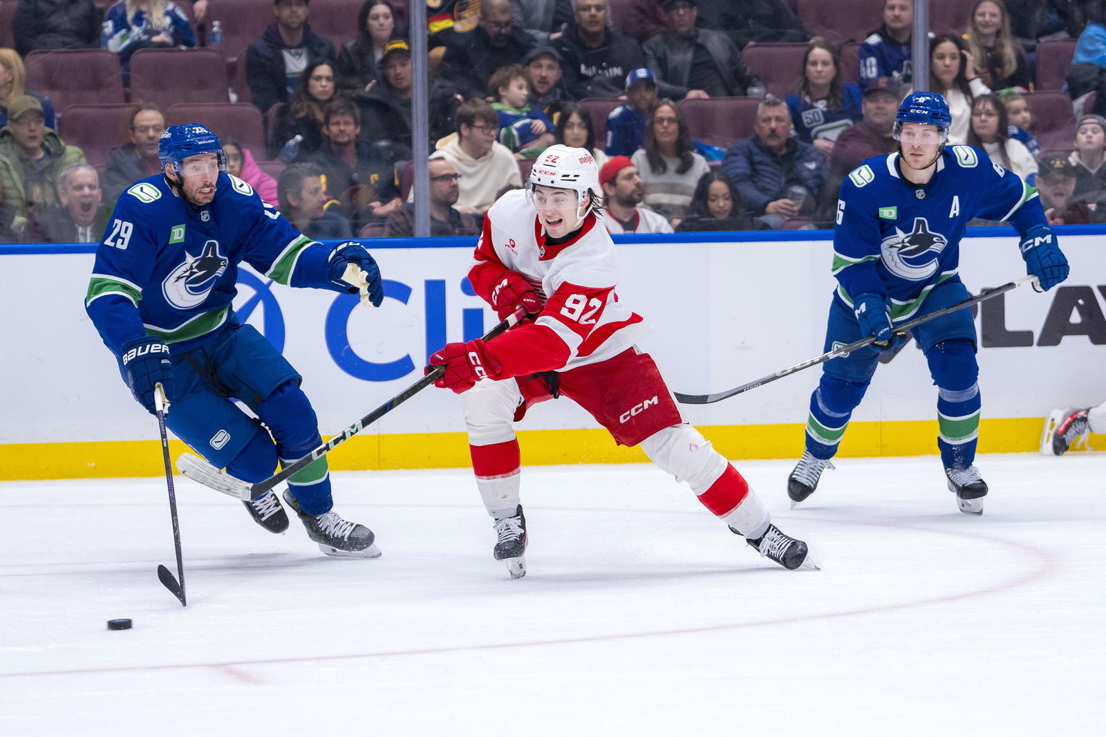 Feb 2, 2025; Vancouver, British Columbia, CAN; Vancouver Canucks forward Brock Boeser (6) watches as defenseman Marcus Pettersson (29) defends against Detroit Red Wings forward Marco Kasper (92) in the third period at Rogers Arena. Mandatory Credit: Bob Frid-Imagn Images