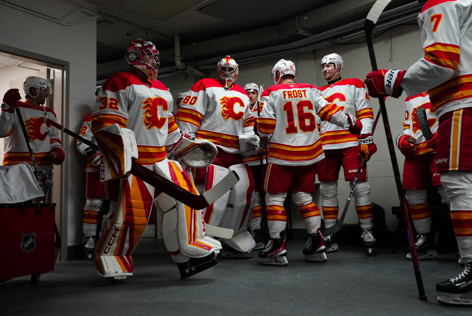 Dustin Wolf and Dan Vladar exit the dressing room for warmups on March 2. (James Guillory-Imagn Images)