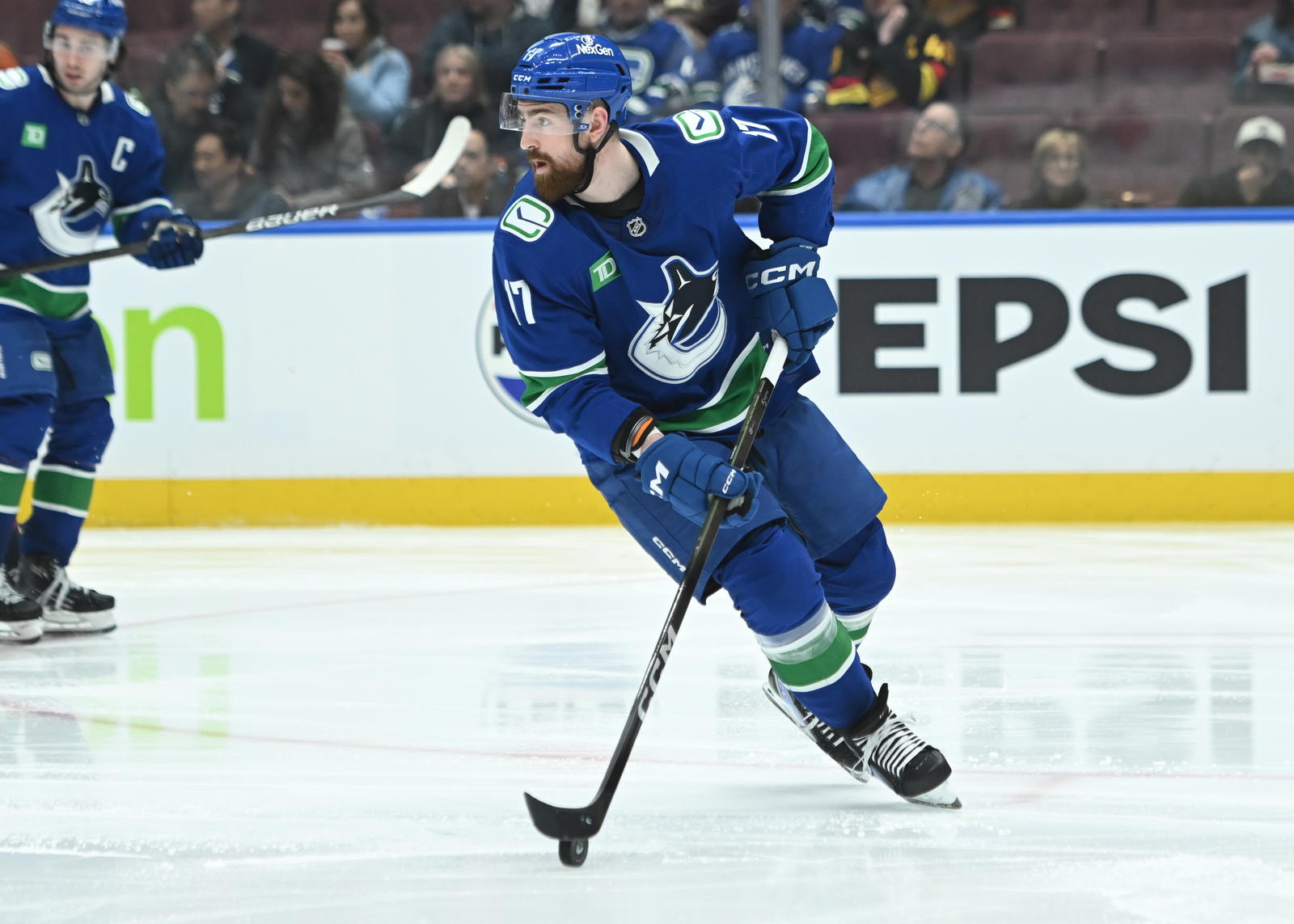 Apr 2, 2025; Vancouver, British Columbia, CAN; Vancouver Canucks defenseman Filip Hronek (17) skates with puck against the Seattle Kraken during the second period at Rogers Arena. Mandatory Credit: Simon Fearn-Imagn Images