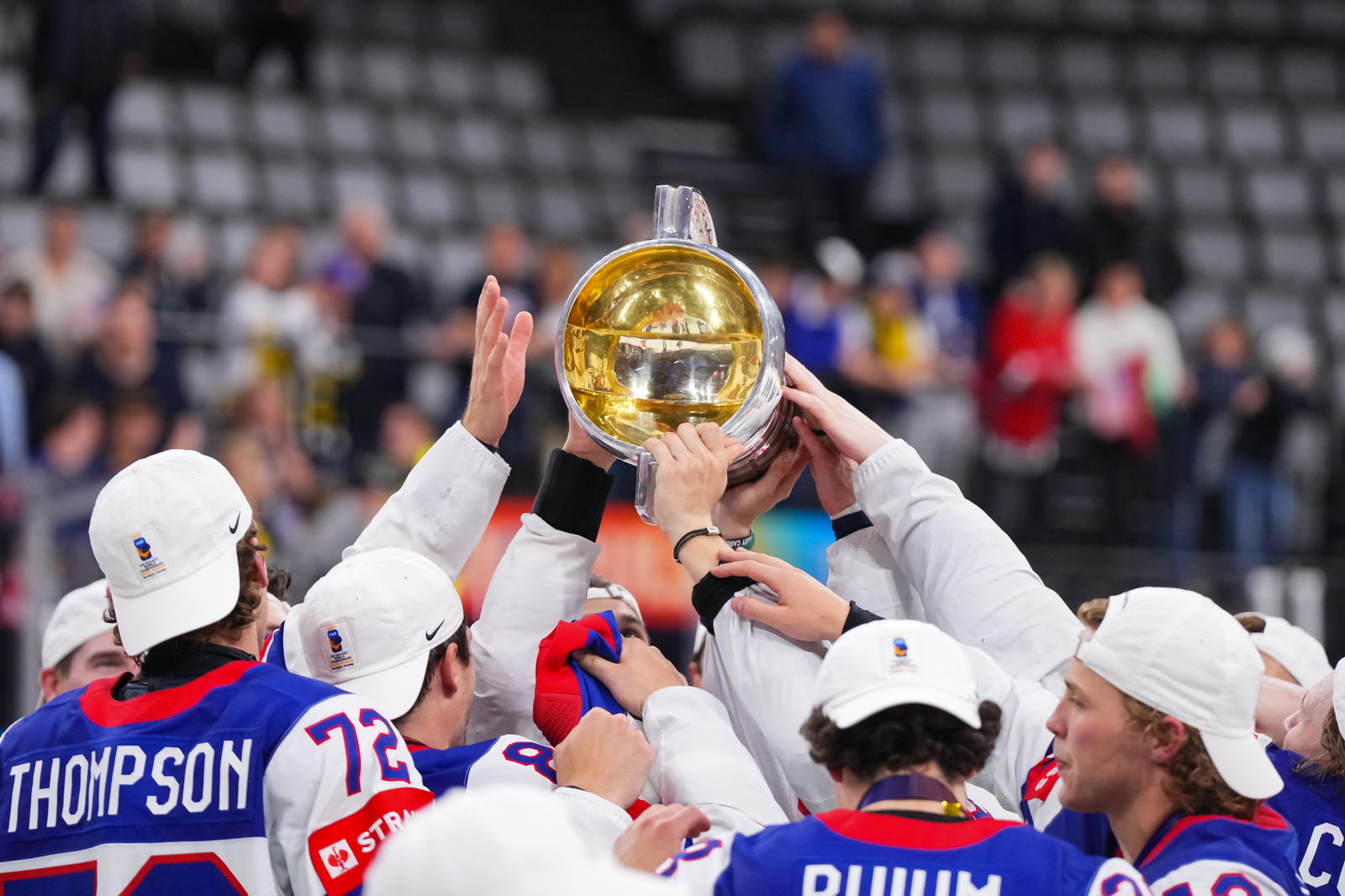 Team USA players hoist the IIHF World Championship trophy. (Photo Credit: @USAHockey/X)&nbsp;