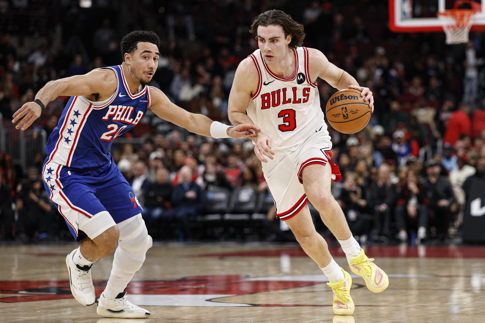 Nov 4, 2025; Chicago, Illinois, USA; Chicago Bulls guard Josh Giddey (3) drives to the basket against Philadelphia 76ers guard Jared McCain (20) during the first half at United Center. Mandatory Credit: Kamil Krzaczynski-Imagn Images