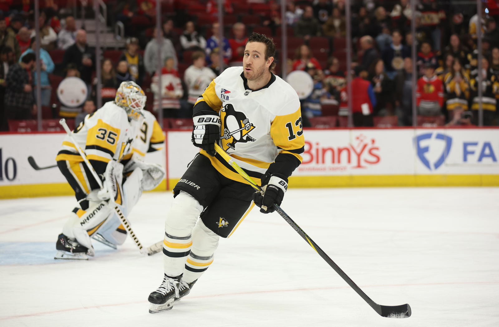 Apr 6, 2025; Chicago, Illinois, USA; Pittsburgh Penguins right wing Kevin Hayes (13) warms up before a game against the Chicago Blackhawks at United Center. Mandatory Credit: Talia Sprague-Imagn Images