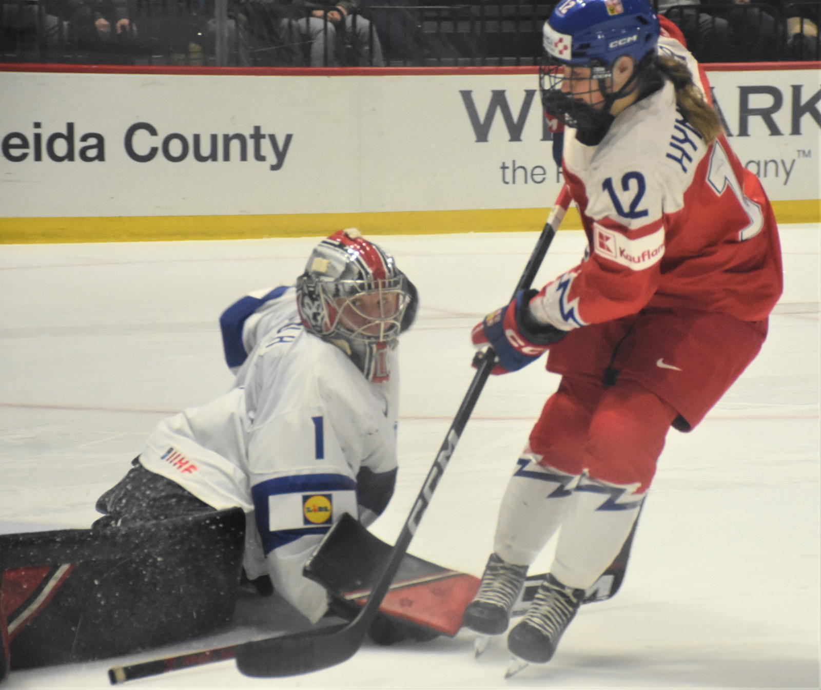 Finland goalie Sanni Ahola stops Czechia's Klara Hymlarova (12) to end the shootout in the bronze-medal game of last year's Women's World Championship in Utica, NY.&nbsp;© JON RATHBUN / Herkimer Times Telegram / USA TODAY NETWORK