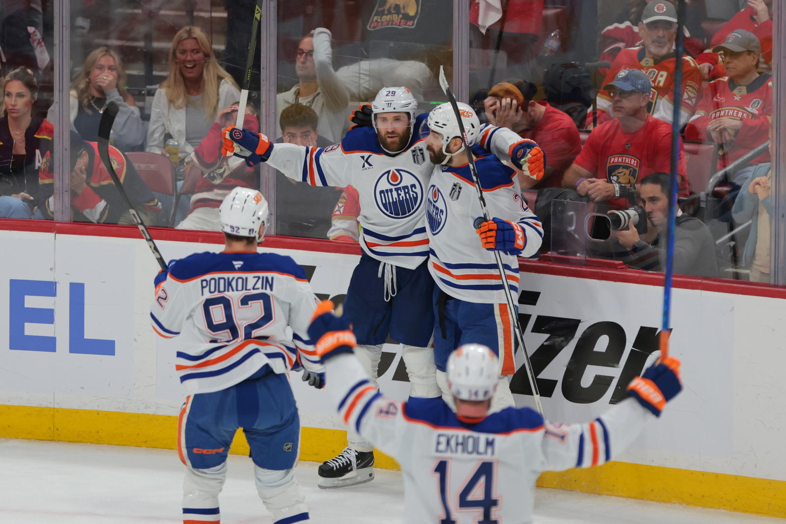 Leon Draisaitl and the Edmonton Oilers celebrate their Game 4 overtime-winner. (Sam Navarro-Imagn Images)